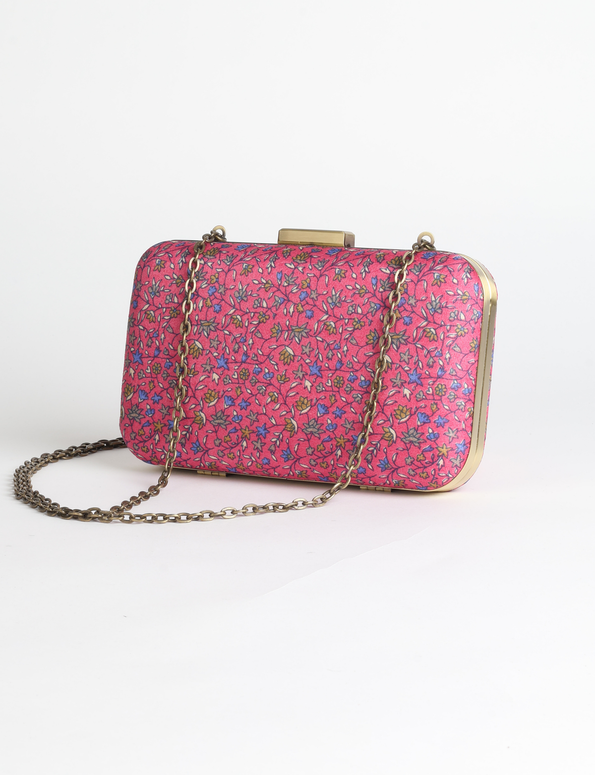 Structured box clutch bag featuring a rigid metal frame, secure clasp closure, detachable metal chain strap, and compact rectangular silhouette.