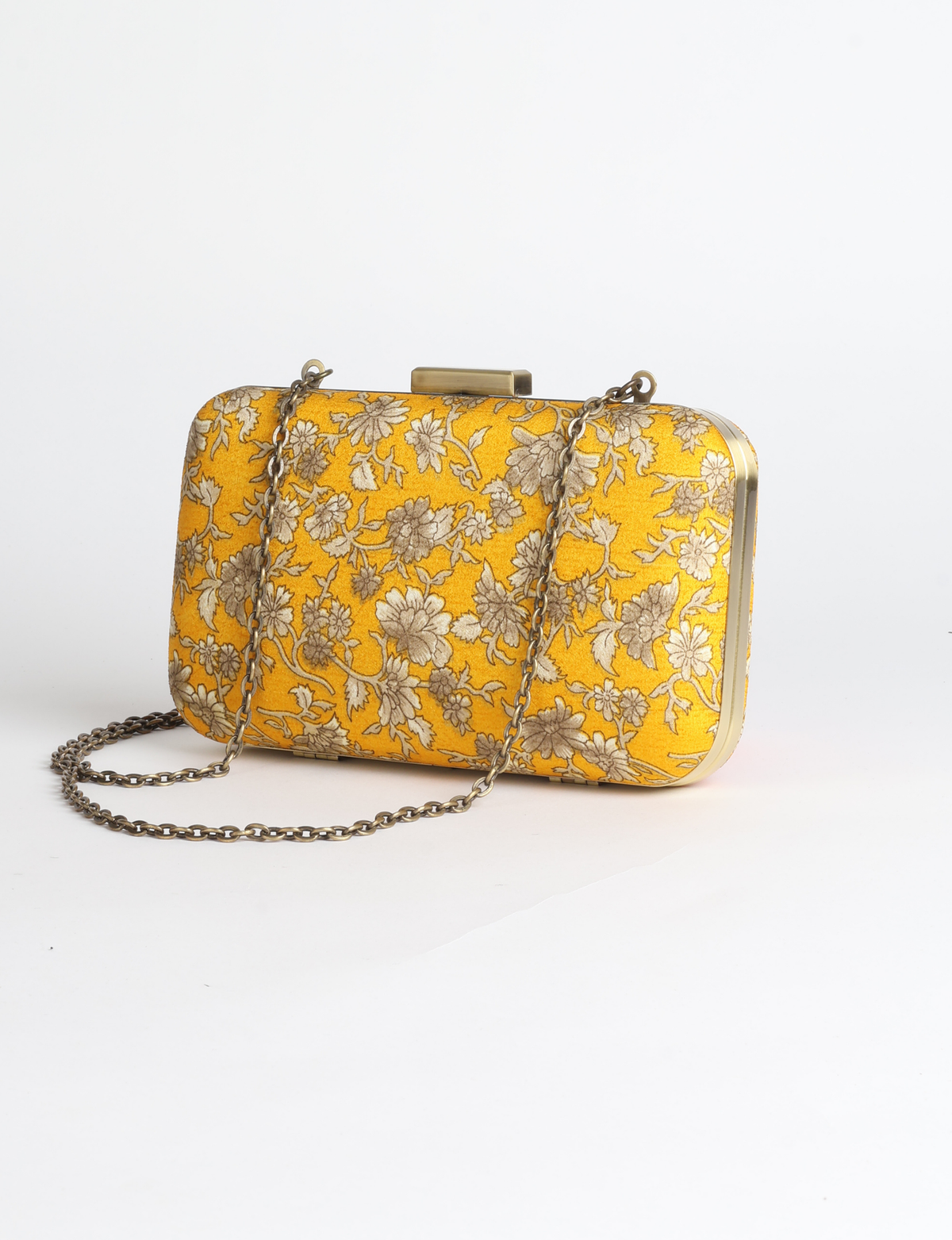 Structured box clutch bag featuring a rigid metal frame, secure clasp closure, detachable metal chain strap, and compact rectangular silhouette.