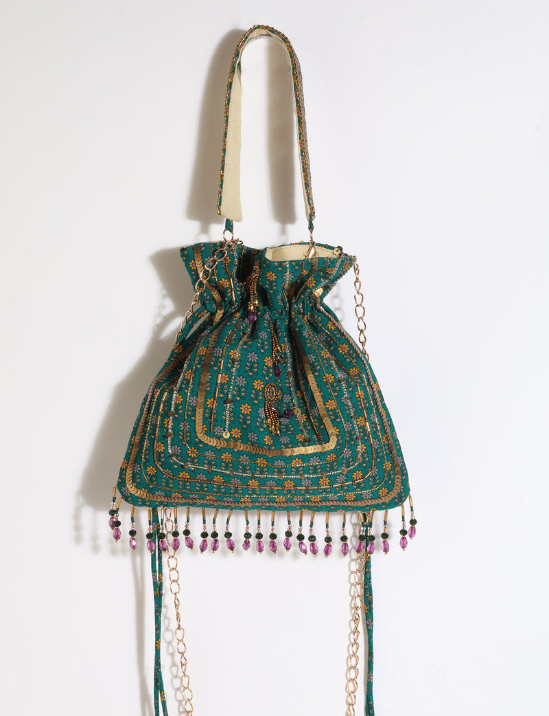 Embroidered DO GOOD potli bag made from upcycled sari fabric with tassel closure and detachable metal chain strap.