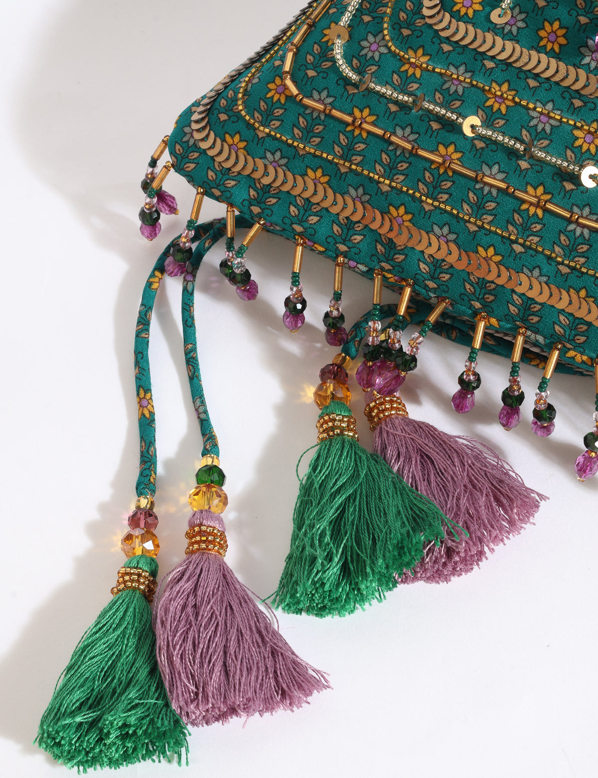 Embroidered DO GOOD potli bag made from upcycled sari fabric with tassel closure and detachable metal chain strap.