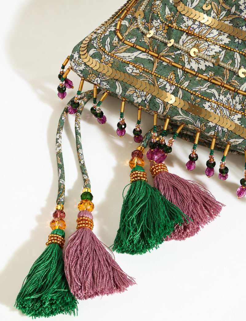 Embroidered DO GOOD potli bag made from upcycled sari fabric with tassel closure and detachable metal chain strap.
