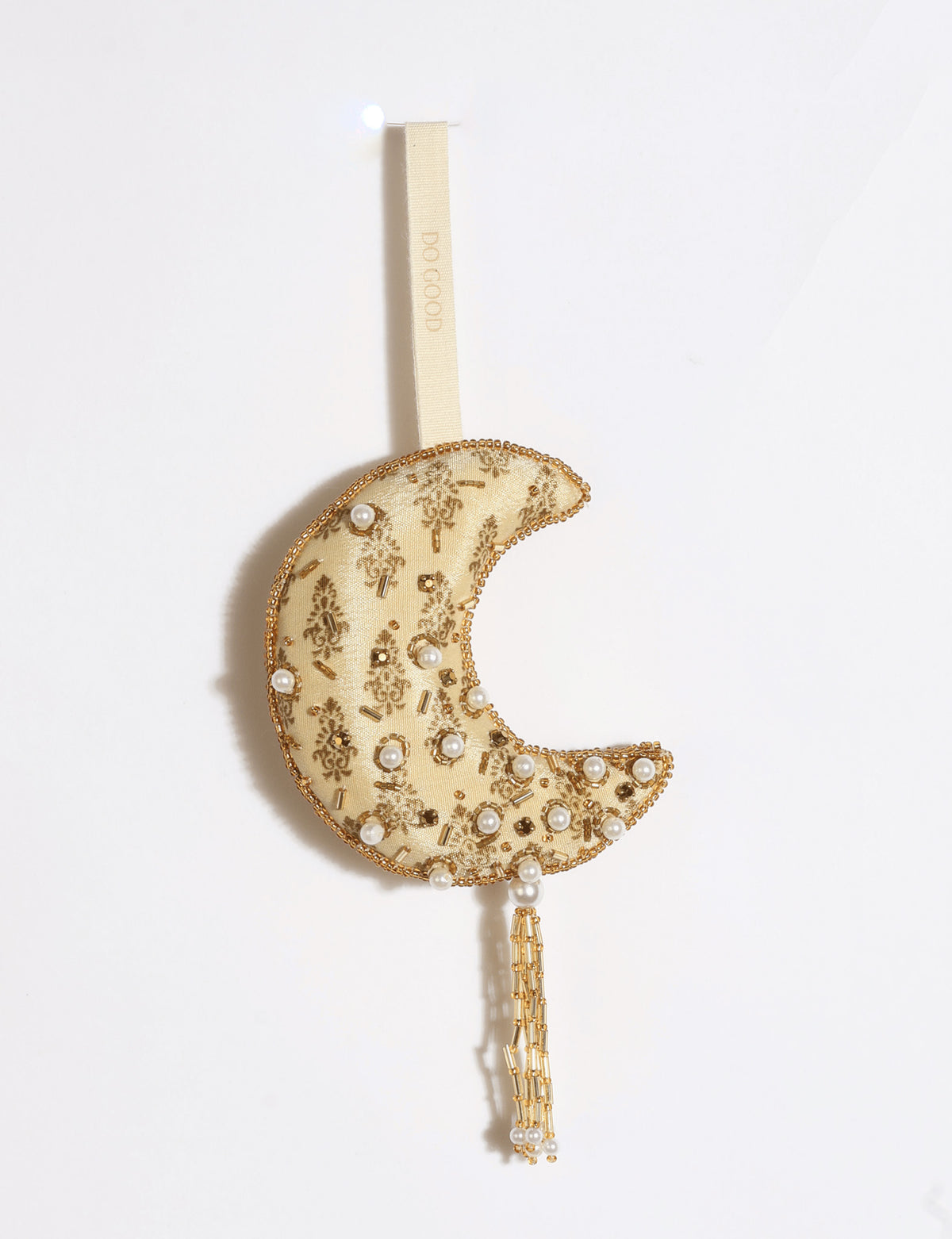 Gold and ivory crescent moon ornament made from preloved saris with silver embroidery, beads, sequins, pearls and tassel.