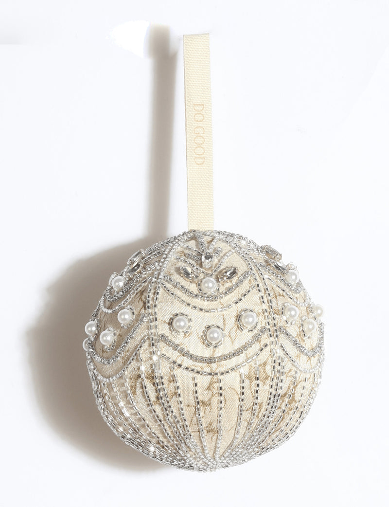 Silver embroidered Christmas ball ornament made from upcycled ivory and grey preloved saris, embellished with stones, sequins, pearls and glass beads.