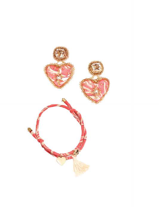 Discover the Forever Set, a stunning blend of sustainable fashion and ethical craftsmanship. Featuring a Heart rope bracelet and Heart drop earrings, each piece is handcrafted from the same recycled sari, promoting zero waste clothing and eco-friendly fashion. Made by skilled female artisans in Mumbai, this set embodies circular fashion, slow fashion, and carbon-neutral clothing. Elevate your look with upcycled women's clothing that’s both stylish and sustainable.