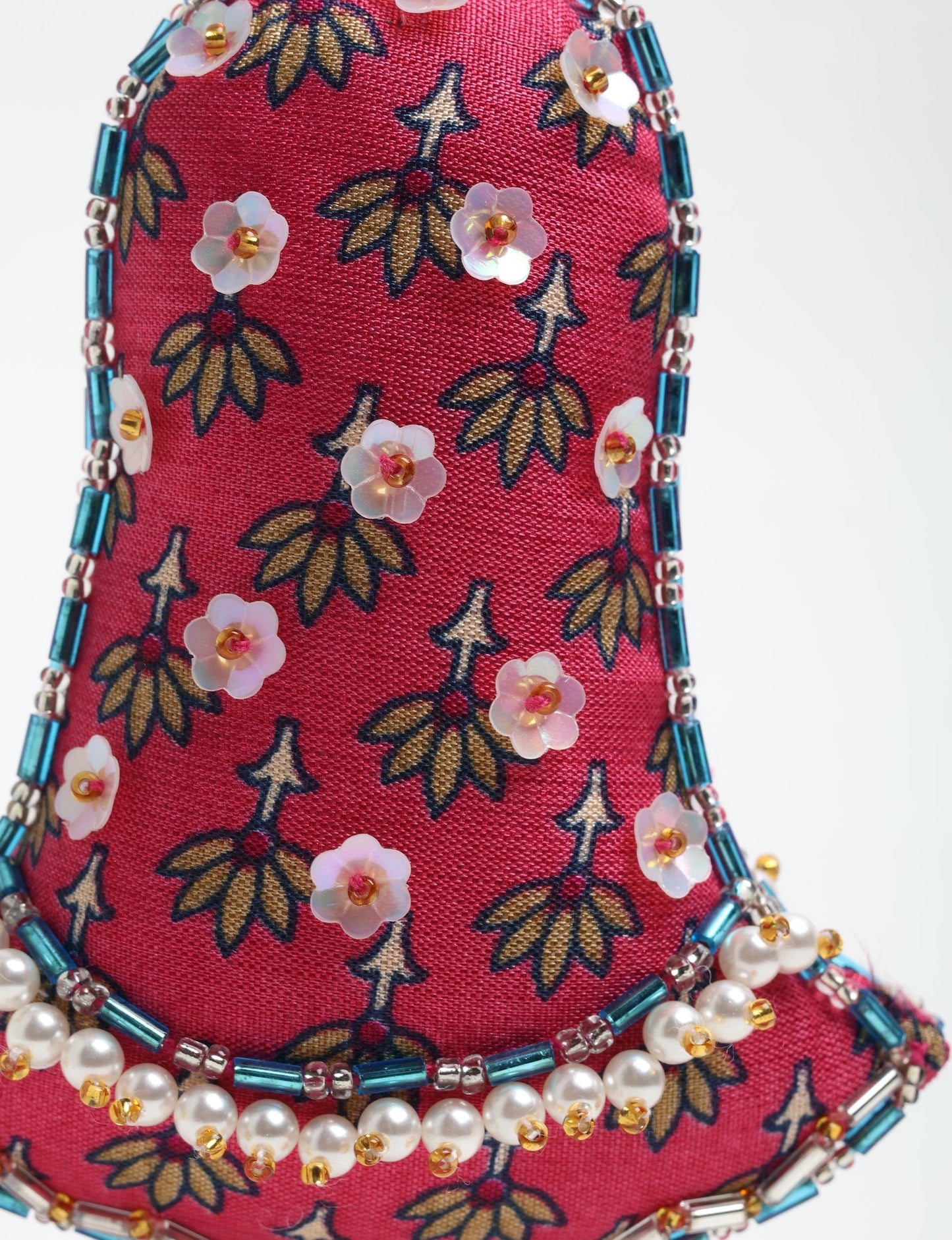 Cheer Bell Ornament made from upcycled sari fabric, showcasing ethical fashion and eco-friendly craftsmanship. A festive sustainable product representing fair trade values, recycled fashion, and environmentally friendly clothing practices.