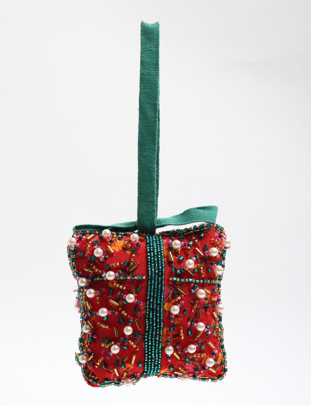 Red fabric gift ornament decorated with multicolored beads and pearls, with a green fabric hanging loop and ribbon