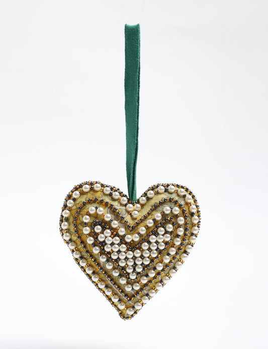 Cheer Heart Ornament made from recycled sari fabric, featuring pearl and bead embroidery. A handcrafted piece of upcycled women’s clothing art that embodies conscious clothing, natural textiles, and sustainable women’s fashion for an environmentally friendly holiday look.