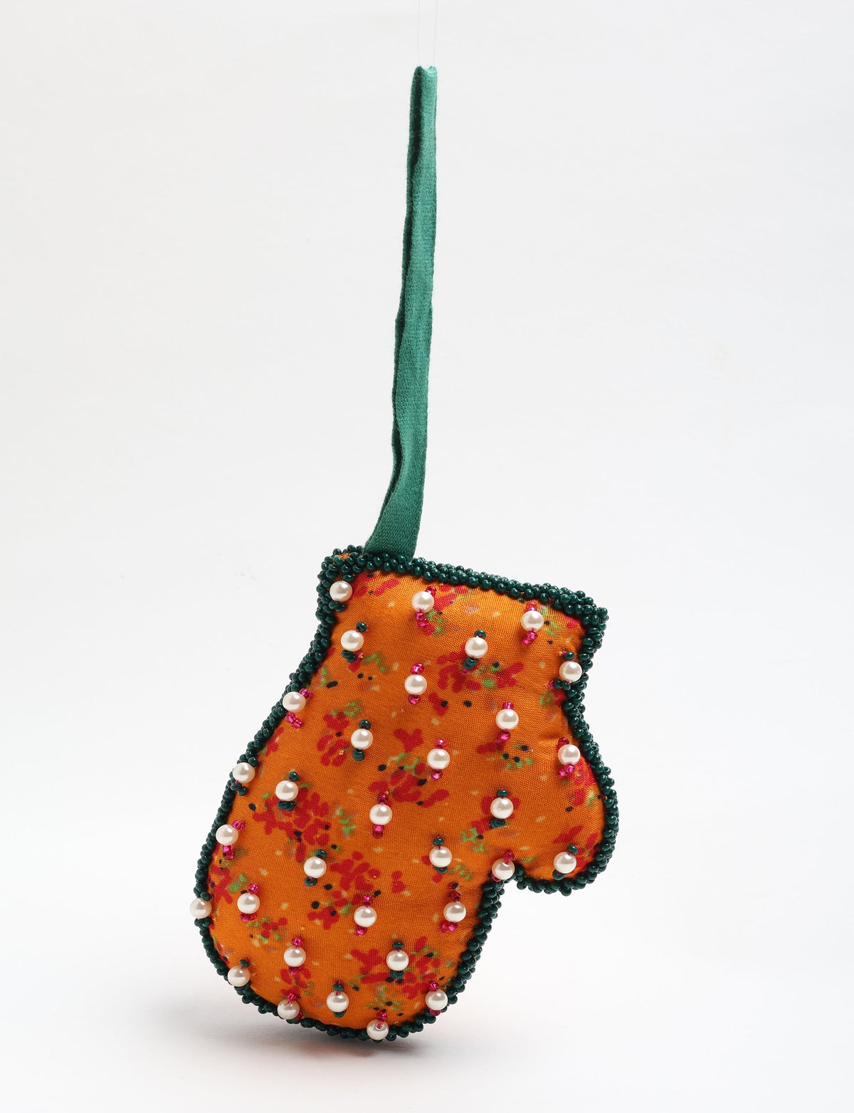 Upcycled Cheer Mitten Ornament handcrafted from recycled sari fabric and organic cotton filling — a cozy example of circular fashion, eco friendly fashion, recycled material clothing, and sustainable women's clothing that celebrates conscious, earth friendly design.