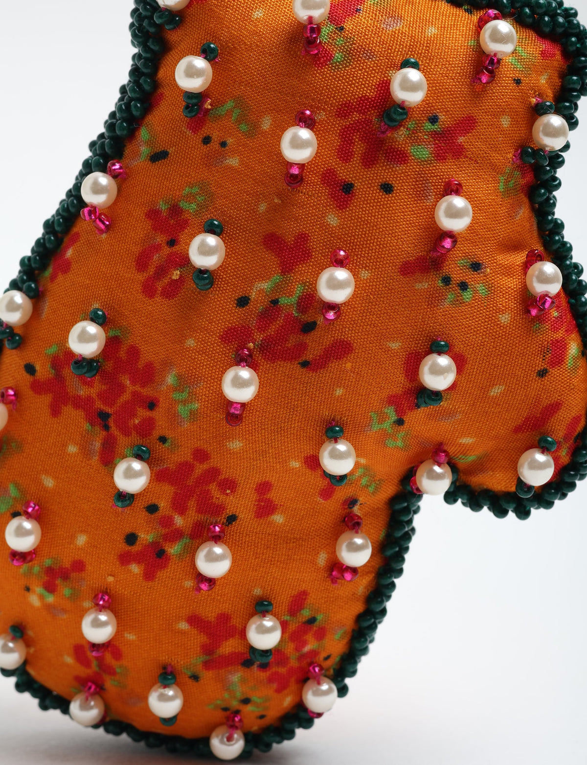 Upcycled Cheer Mitten Ornament handcrafted from recycled sari fabric and organic cotton filling — a cozy example of circular fashion, eco friendly fashion, recycled material clothing, and sustainable women's clothing that celebrates conscious, earth friendly design.