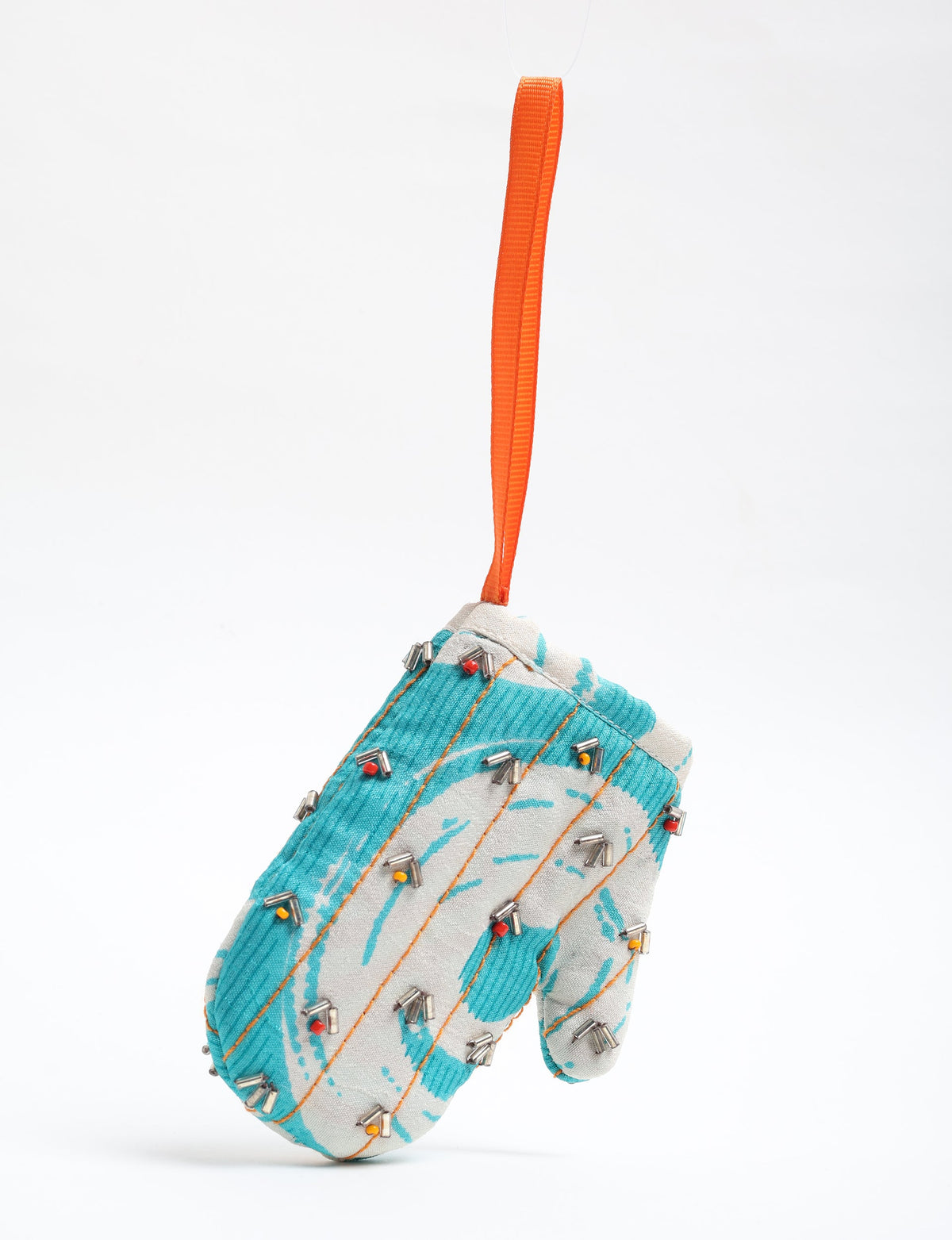Upcycled Cheer Mitten Ornament handcrafted from recycled sari fabric and organic cotton filling — a cozy example of circular fashion, eco friendly fashion, recycled material clothing, and sustainable women's clothing that celebrates conscious, earth friendly design.