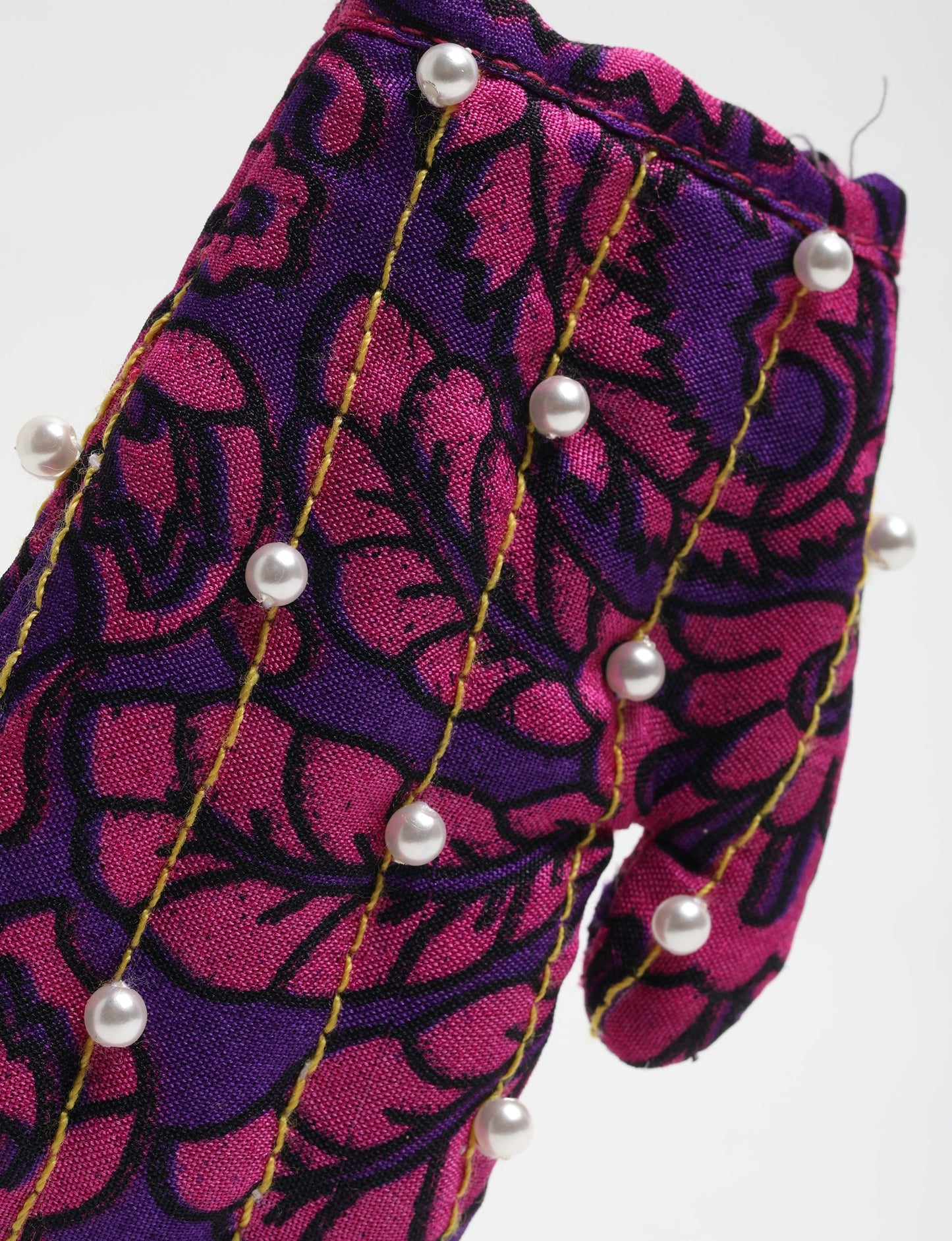 Upcycled Cheer Mitten Ornament handcrafted from recycled sari fabric and organic cotton filling — a cozy example of circular fashion, eco friendly fashion, recycled material clothing, and sustainable women's clothing that celebrates conscious, earth friendly design.