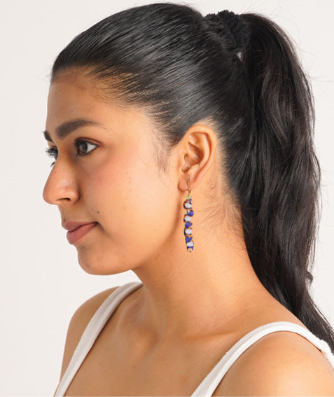 Wavy Dangler Earrings made from upcycled materials, showcasing eco-friendly fashion and sustainable women's clothing. A delicate blend of style and environmentally friendly design, perfect for those who value conscious clothing and circular fashion.