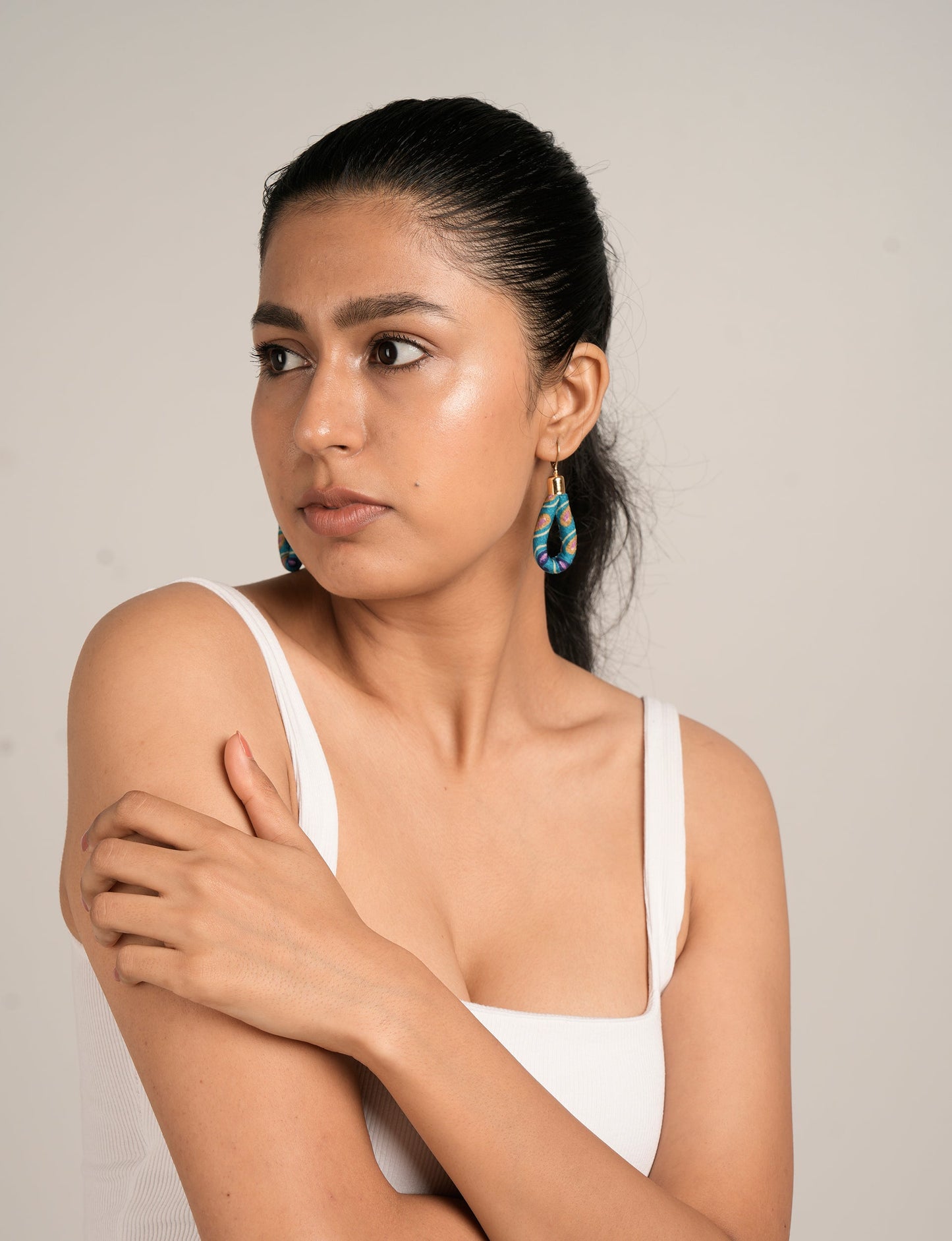 Elevate your style sustainably with our Rope Earrings. Crafted from cotton rope hand-wrapped with pre-loved saris, these earrings are a testament to ethical and green fashion. Make a conscious choice for a brighter, eco-friendly future.