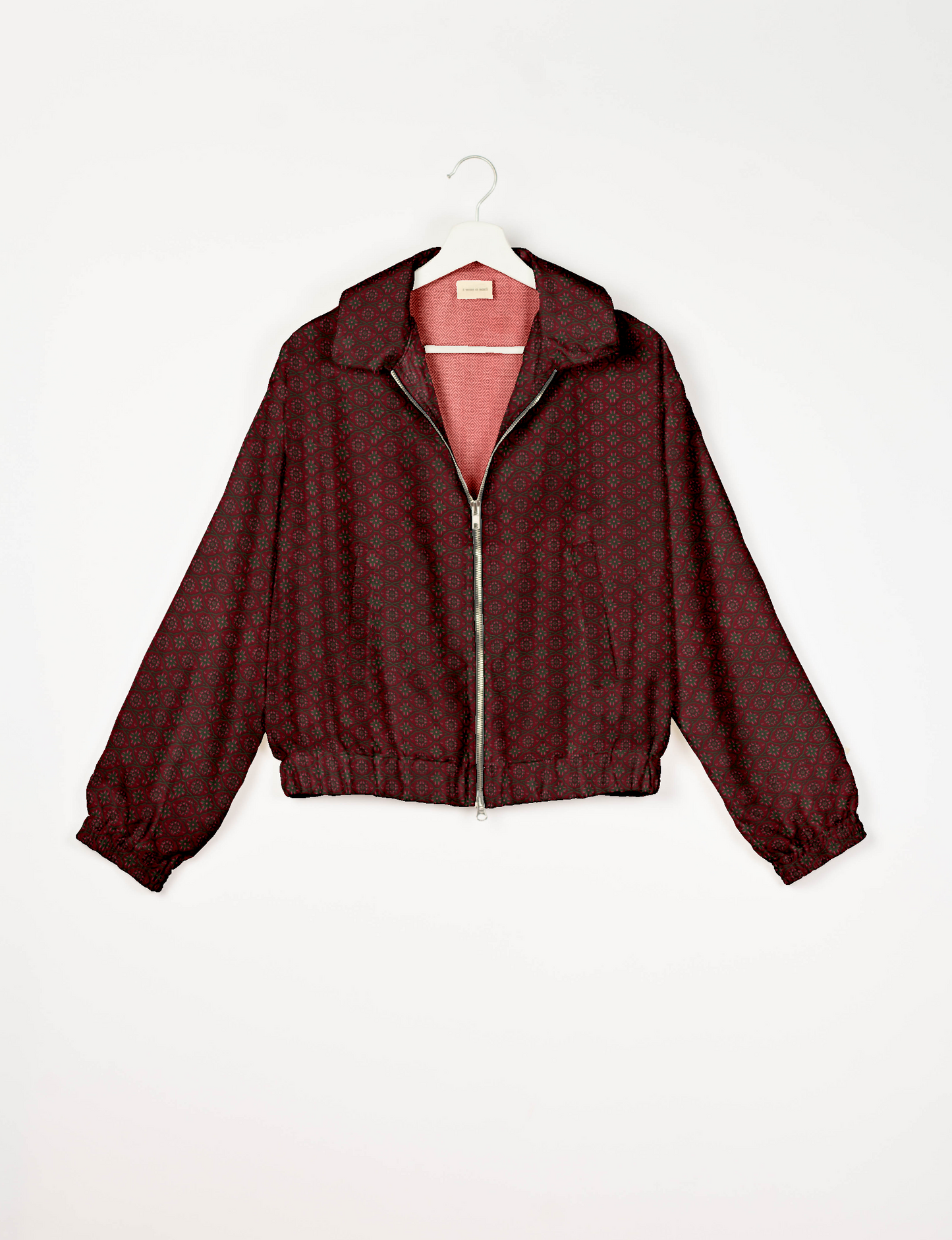 Stylish BOMBER JACKET, an upcycled clothing masterpiece with a cute cropped shape, elasticated details, and detachable metallic zipper. Contrast sari print lining adds a unique touch. Explore sustainable and eco-friendly fashion.