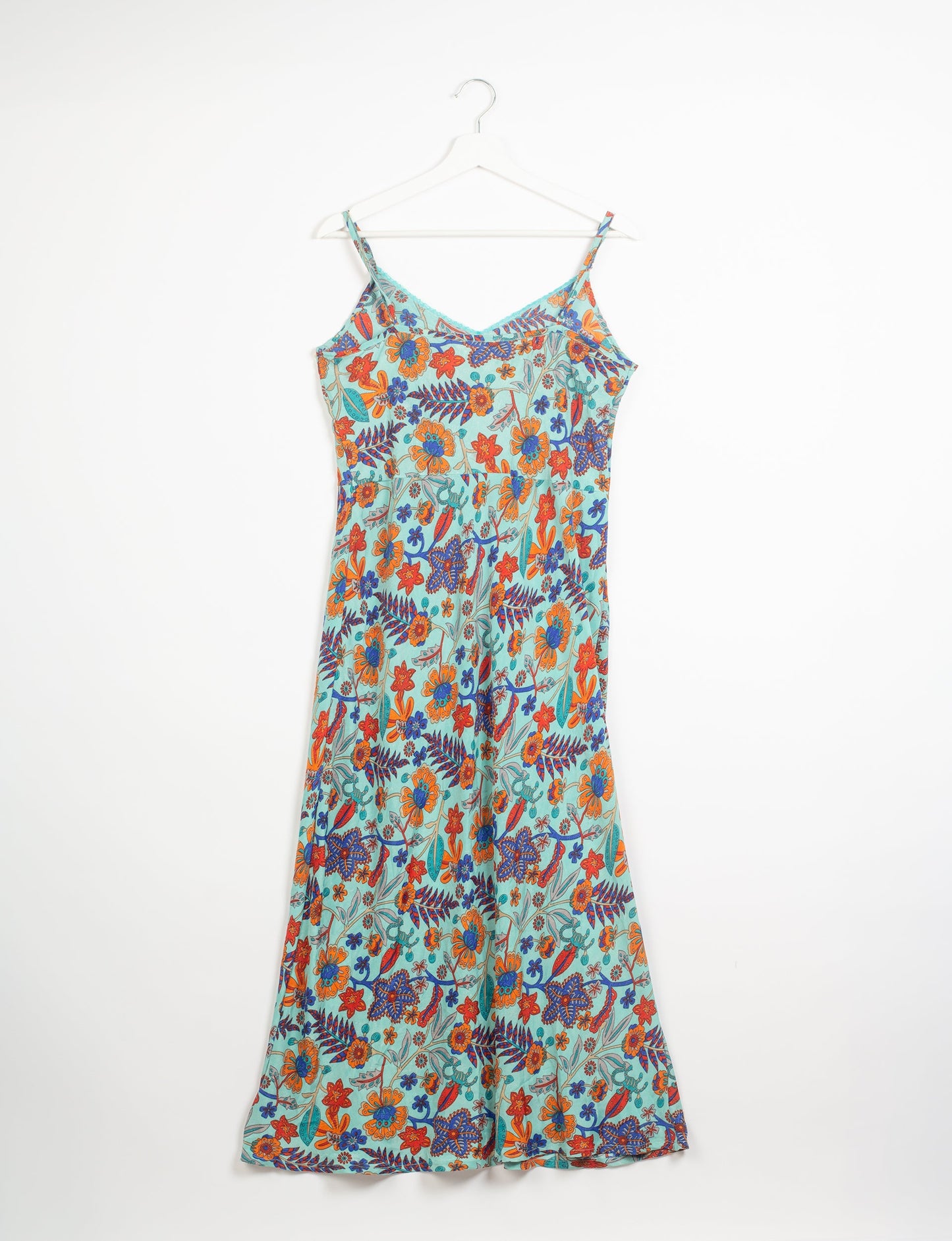 Spaghetti strap dress made from sustainable materials, embodying ethical fashion principles. Ideal for eco-friendly travelers seeking laid-back style.