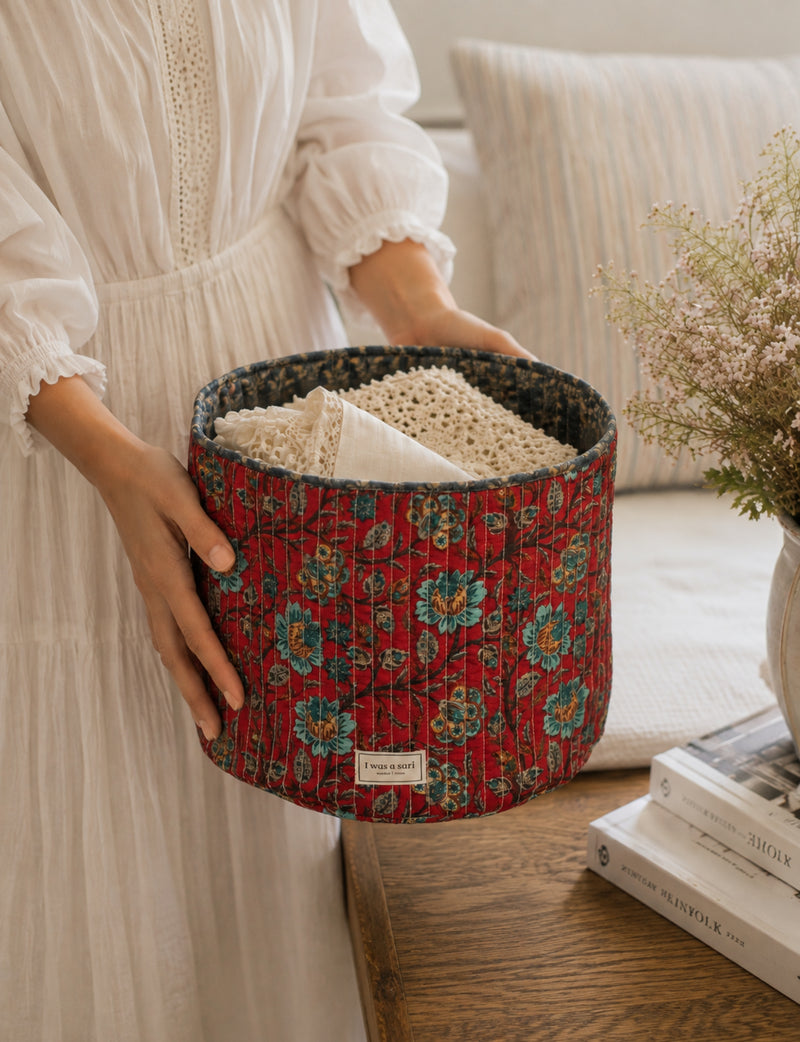 Quilted storage basket in a soft cylindrical shape, available in S, M, L, and XL sizes
