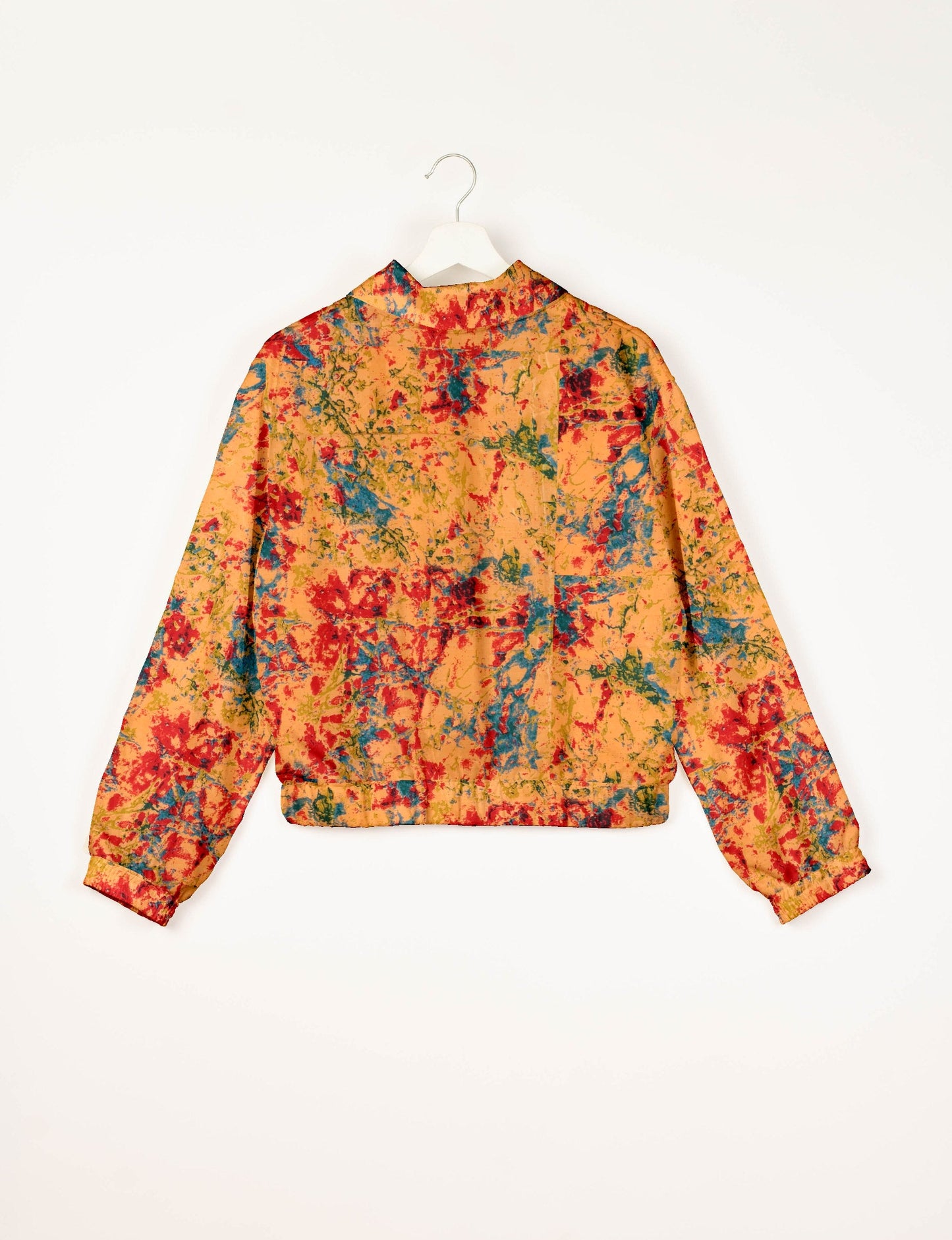 Stylish BOMBER JACKET, an upcycled clothing masterpiece with a cute cropped shape, elasticated details, and detachable metallic zipper. Contrast sari print lining adds a unique touch. Explore sustainable and eco-friendly fashion.