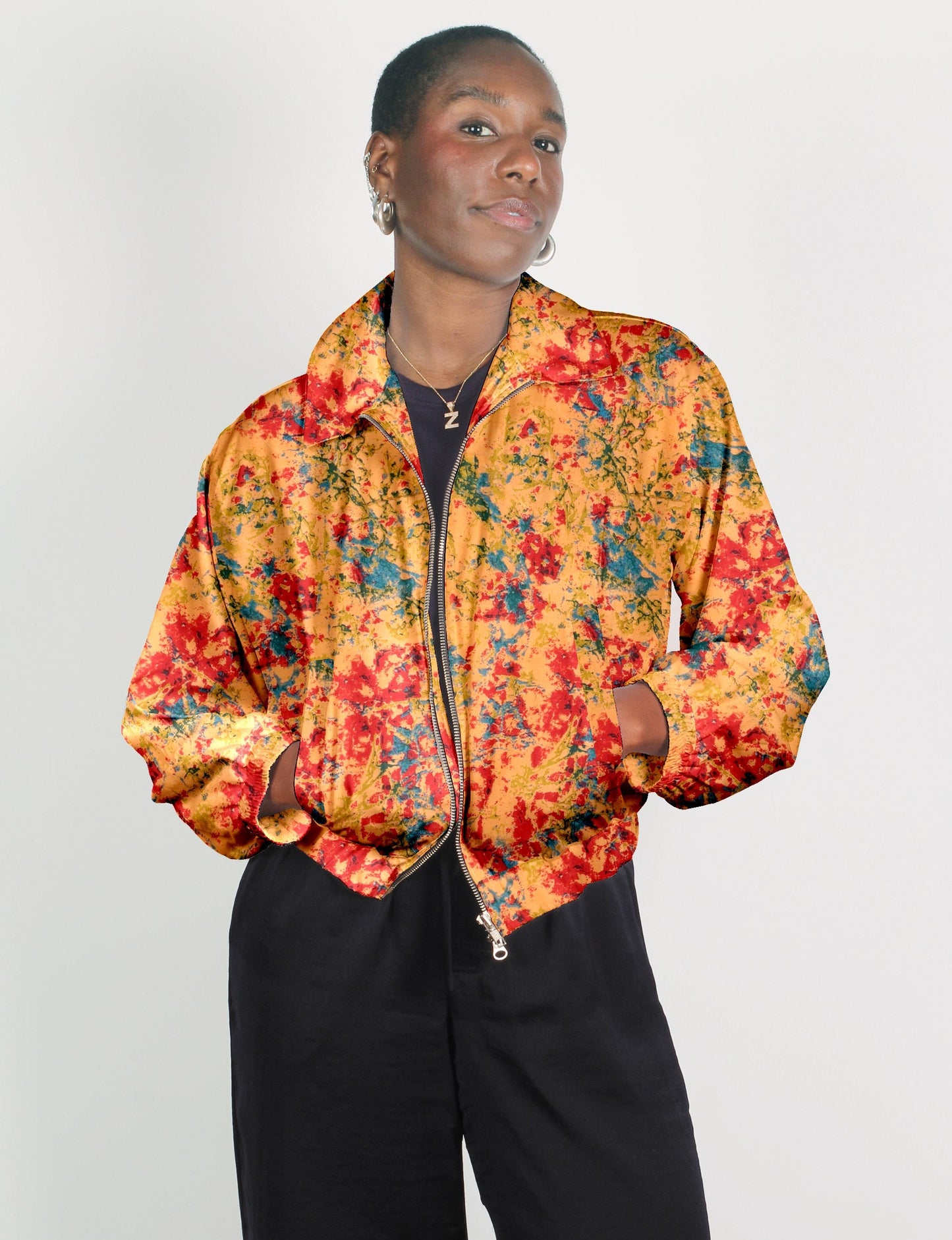 Stylish BOMBER JACKET, an upcycled clothing masterpiece with a cute cropped shape, elasticated details, and detachable metallic zipper. Contrast sari print lining adds a unique touch. Explore sustainable and eco-friendly fashion.