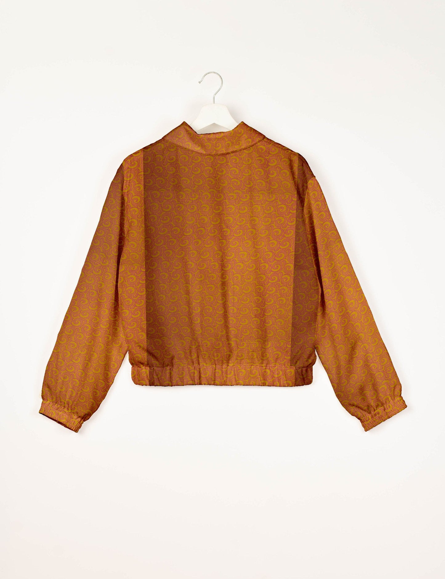 Upcycled Bomber Jacket made from recycled sari materials, featuring a cute cropped shape, elasticated hem and cuffs, and contrast sari print lining. Sustainable apparel promoting eco-friendly fashion and ethical clothing.