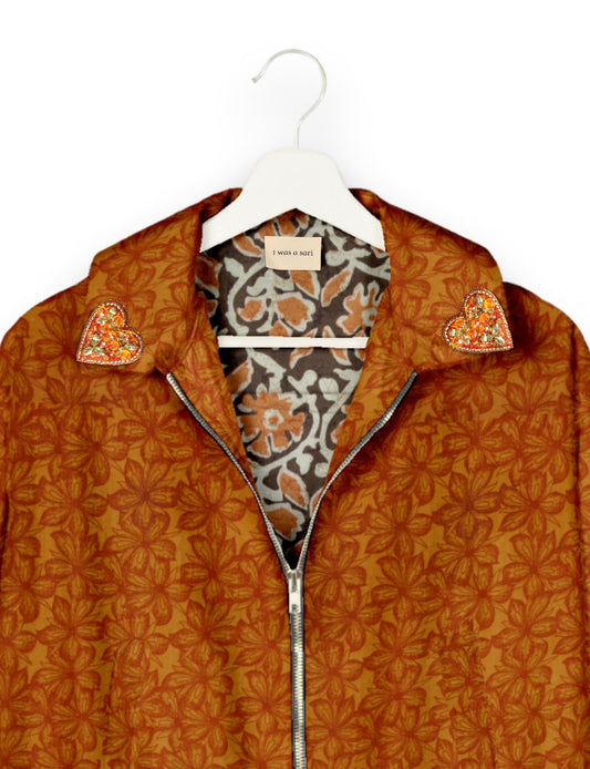 Make a bold statement with our Heart Drop Earrings, a symbol of conscious luxury and ethical fashion. Handcrafted using the intricate Aari embroidery technique, these earrings are made from upcycled sari fabric, embracing slow fashion and zero waste clothing. Elevate your look with sustainable apparel that supports fair trade fashion while reducing textile waste. Choose eco-friendly fashion that speaks of love, artistry, and responsibility.