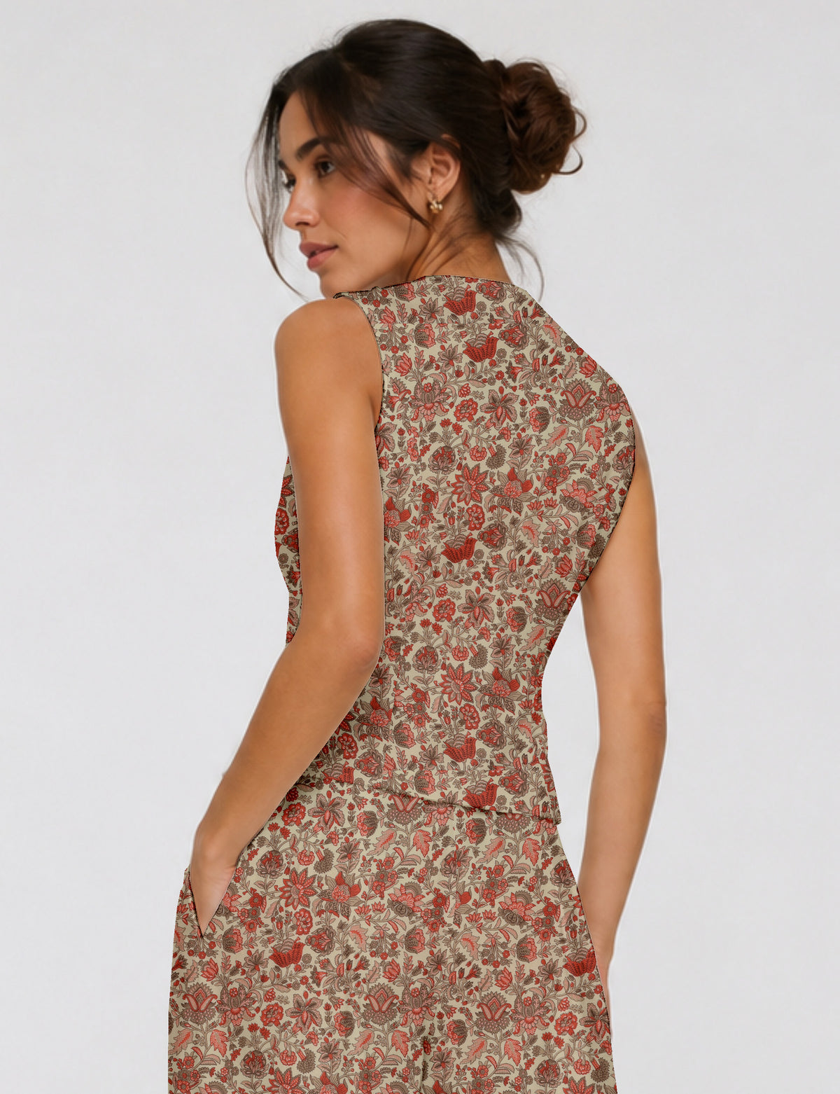 Women's fitted waistcoat with V-neck, single-breasted button closure, tailored silhouette, and pointed hem in sustainable fashion.