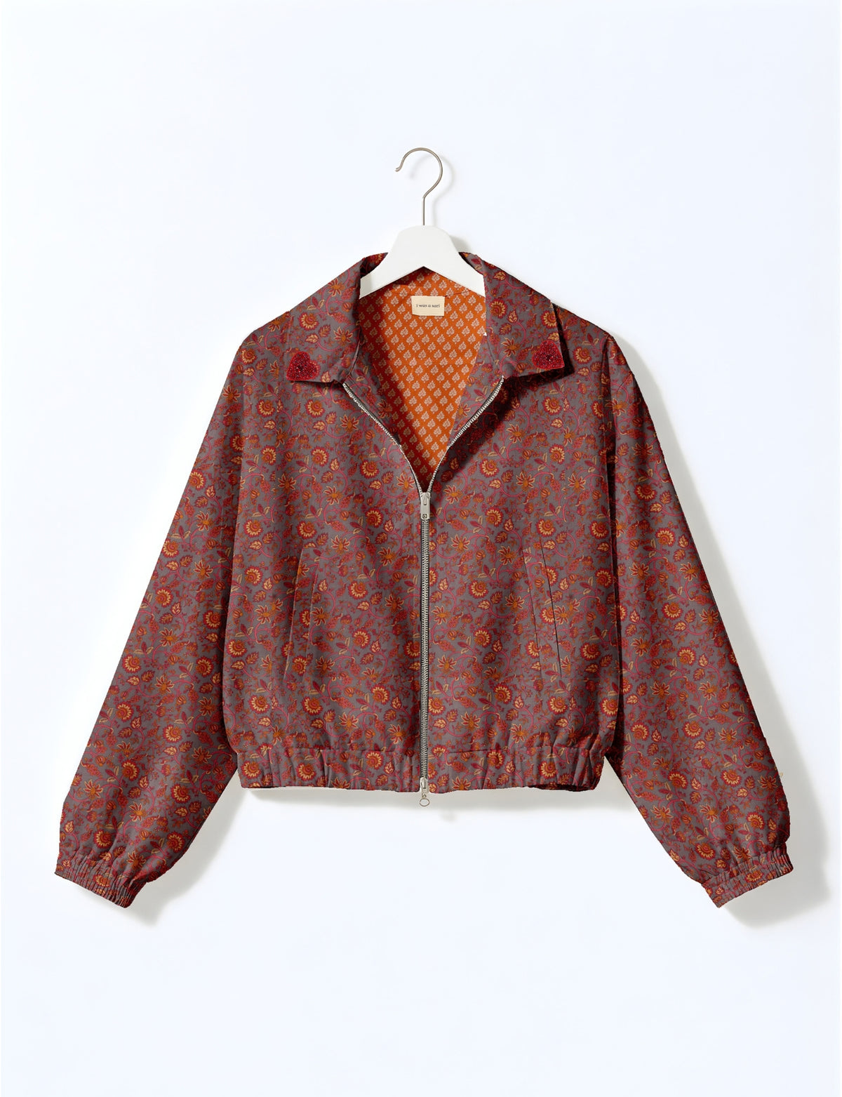 Love Bomber Jacket made from recycled fabric, featuring hand-stitched Aari embroidery. A unique piece of zero-waste clothing, part of the circular fashion movement. Designed with upcycled materials for a stylish yet environmentally friendly clothing choice.