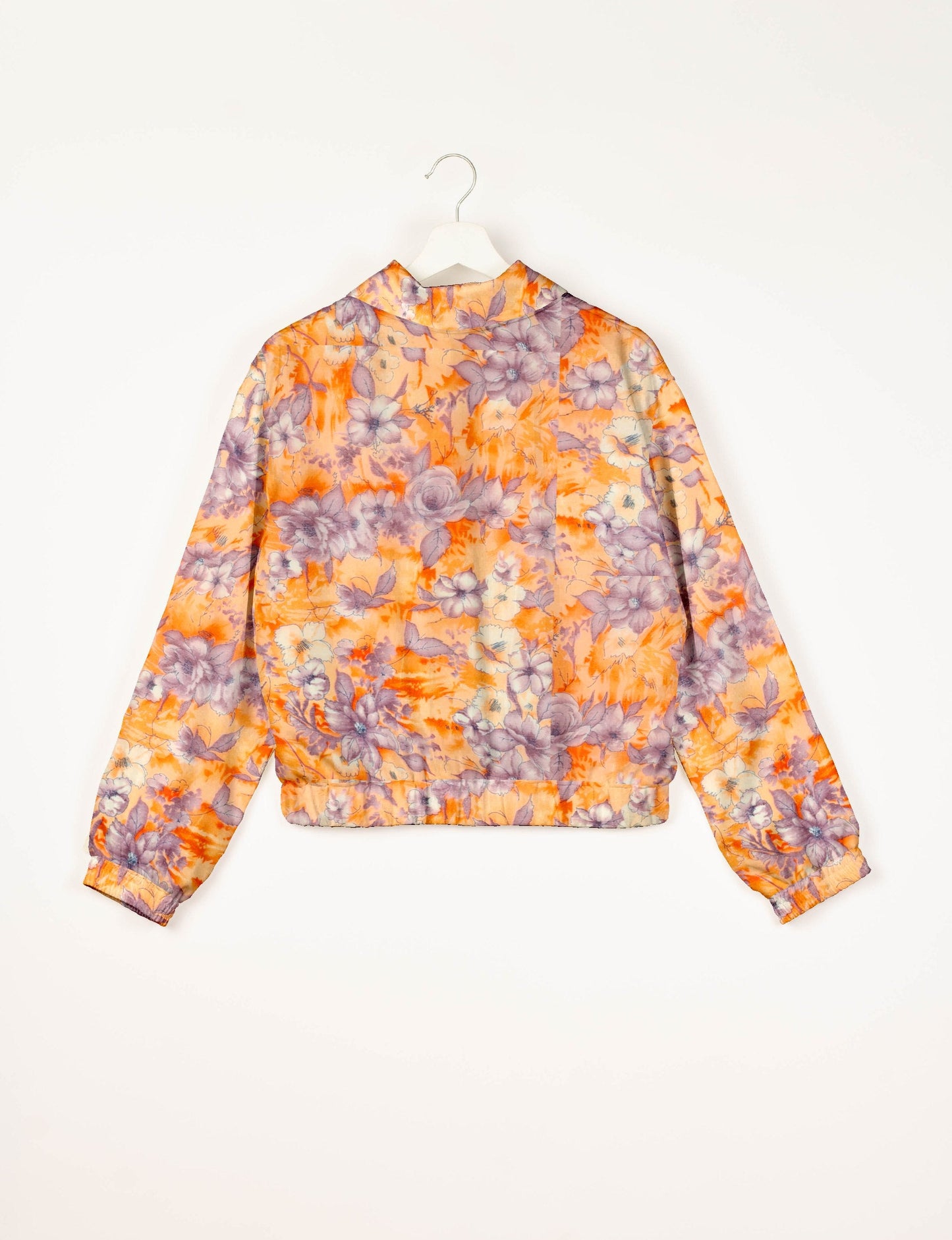 Stylish BOMBER JACKET, an upcycled clothing masterpiece with a cute cropped shape, elasticated details, and detachable metallic zipper. Contrast sari print lining adds a unique touch. Explore sustainable and eco-friendly fashion.