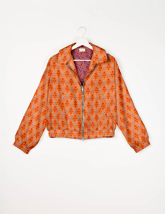 Stylish BOMBER JACKET, an upcycled clothing masterpiece with a cute cropped shape, elasticated details, and detachable metallic zipper. Contrast sari print lining adds a unique touch. Explore sustainable and eco-friendly fashion.