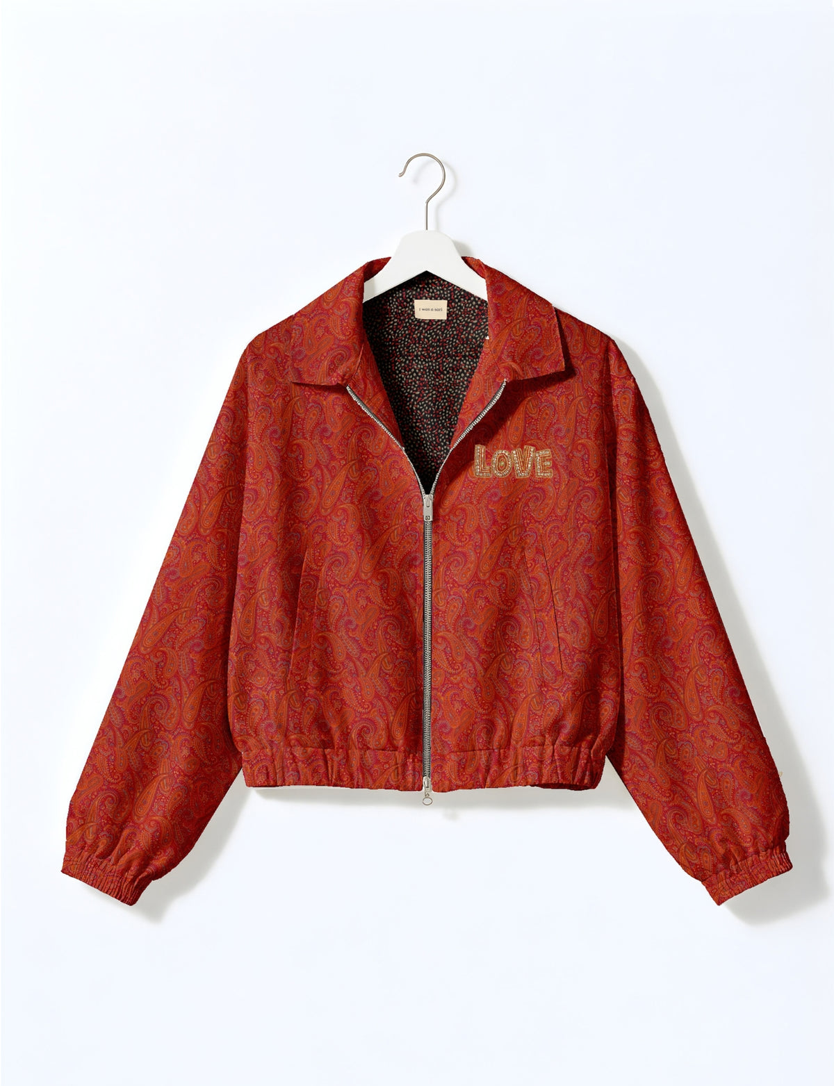 Love Bomber Jacket made from recycled fabric, featuring hand-stitched Aari embroidery. A unique piece of zero-waste clothing, part of the circular fashion movement. Designed with upcycled materials for a stylish yet environmentally friendly clothing choice.