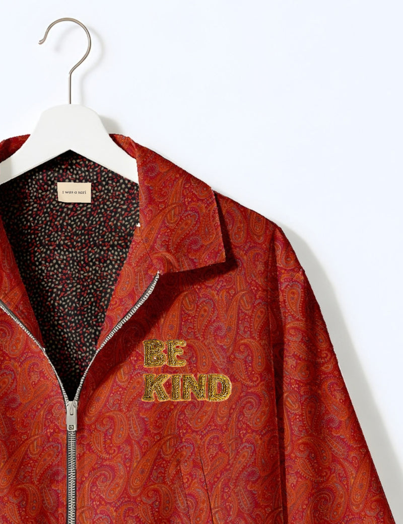 BE KIND Bomber jacket made from upcycled sari fabric with handcrafted Aari embroidery by female artisans.