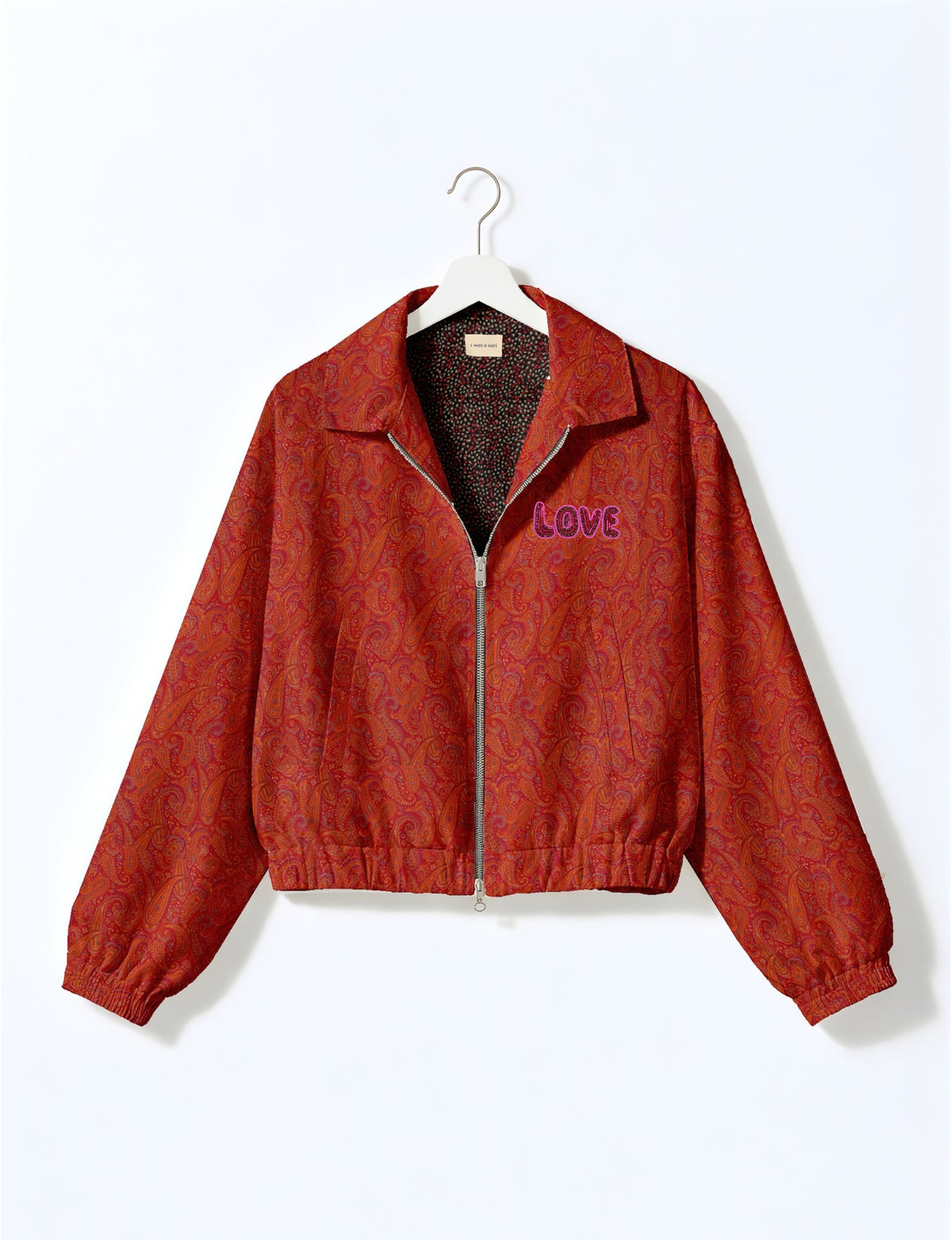 Love Bomber Jacket made from recycled fabric, featuring hand-stitched Aari embroidery. A unique piece of zero-waste clothing, part of the circular fashion movement. Designed with upcycled materials for a stylish yet environmentally friendly clothing choice.