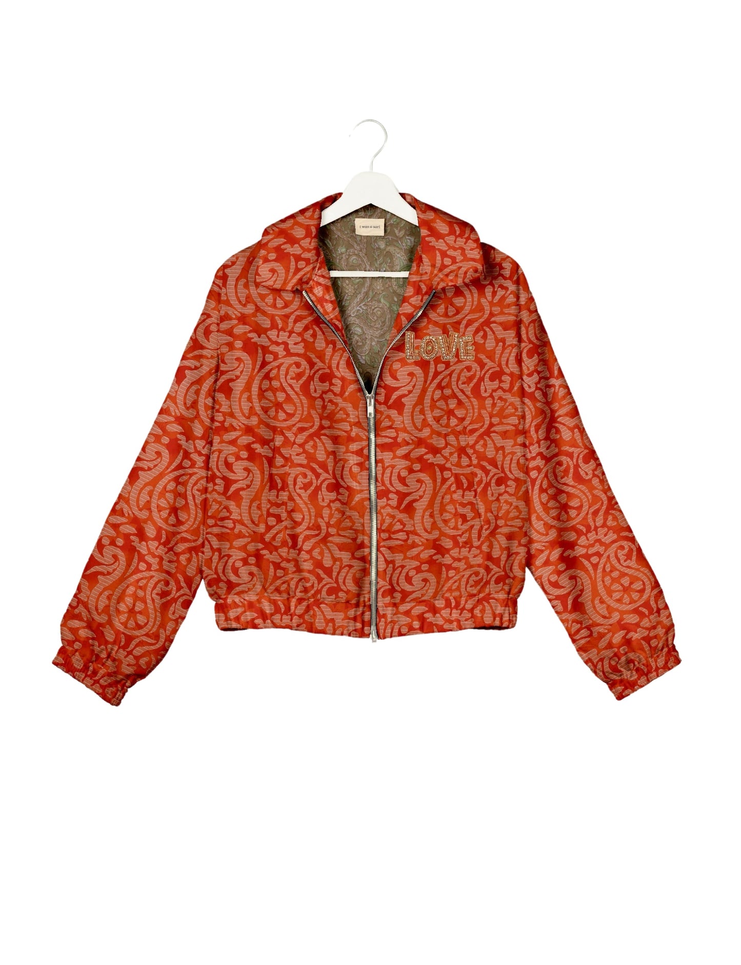 Love Bomber Jacket made from recycled fabric, featuring hand-stitched Aari embroidery. A unique piece of zero-waste clothing, part of the circular fashion movement. Designed with upcycled materials for a stylish yet environmentally friendly clothing choice.