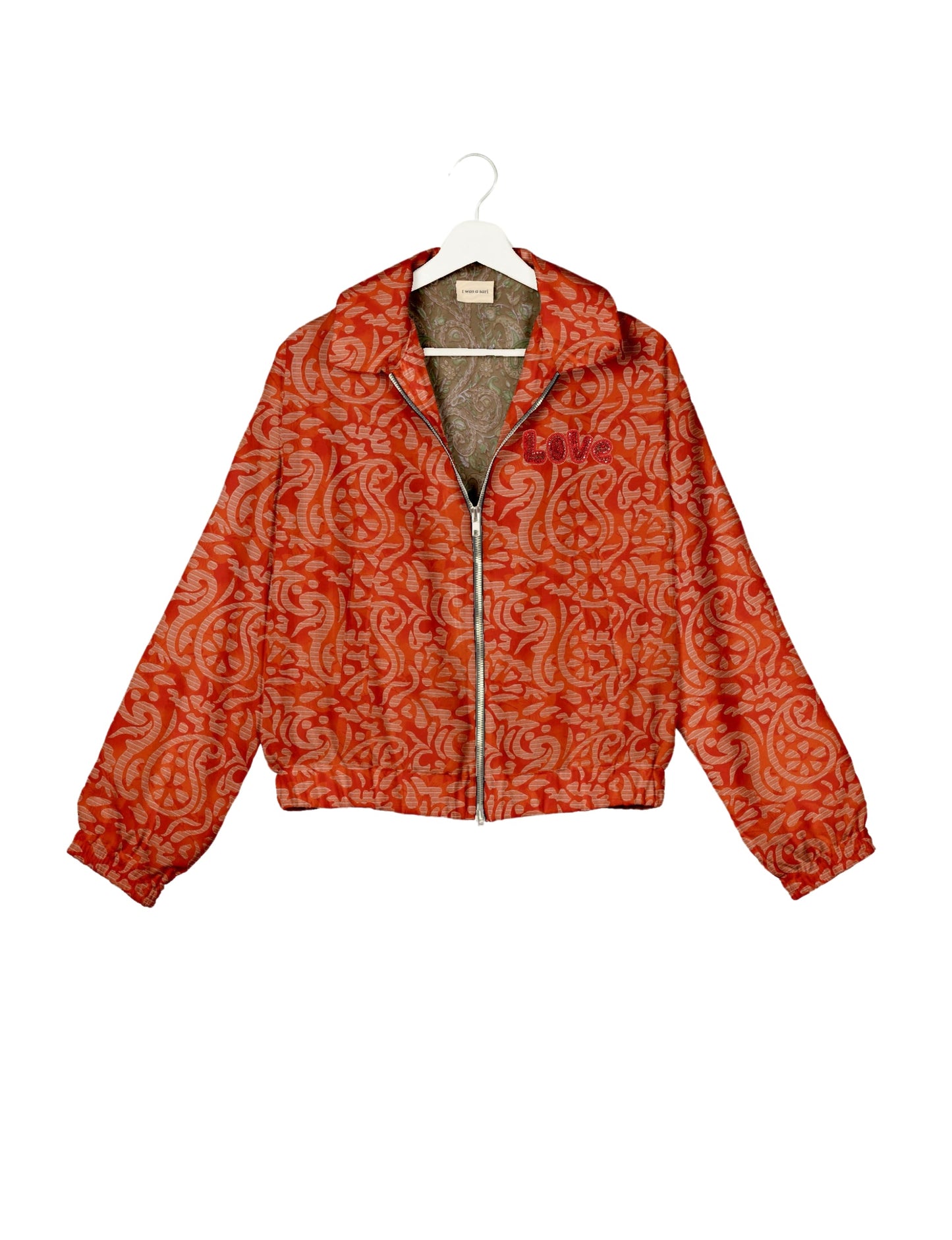 Love Bomber Jacket made from recycled fabric, featuring hand-stitched Aari embroidery. A unique piece of zero-waste clothing, part of the circular fashion movement. Designed with upcycled materials for a stylish yet environmentally friendly clothing choice.