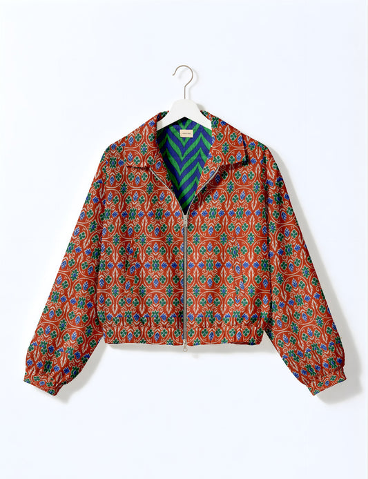 Upcycled Bomber Jacket made from recycled sari materials, featuring a cute cropped shape, elasticated hem and cuffs, and contrast sari print lining. Sustainable apparel promoting eco-friendly fashion and ethical clothing.
