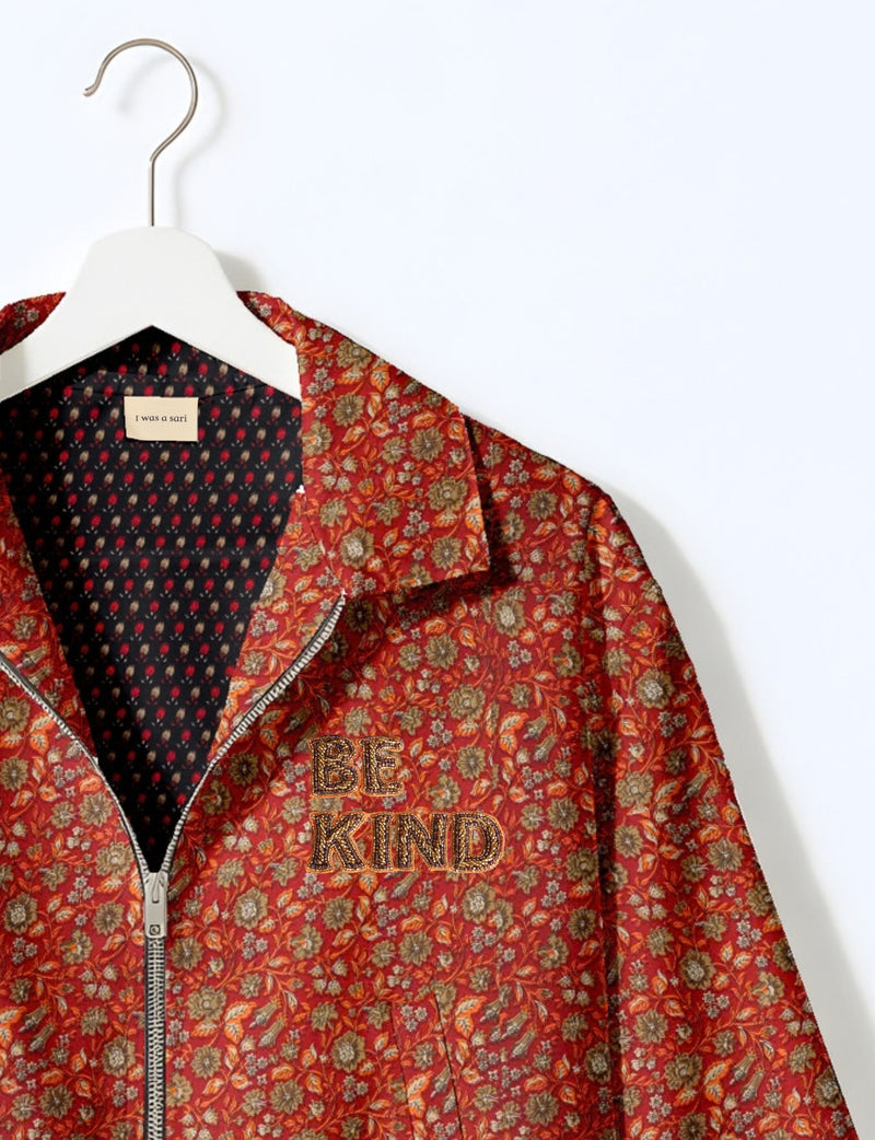 BE KIND Bomber jacket made from upcycled sari fabric with handcrafted Aari embroidery by female artisans.