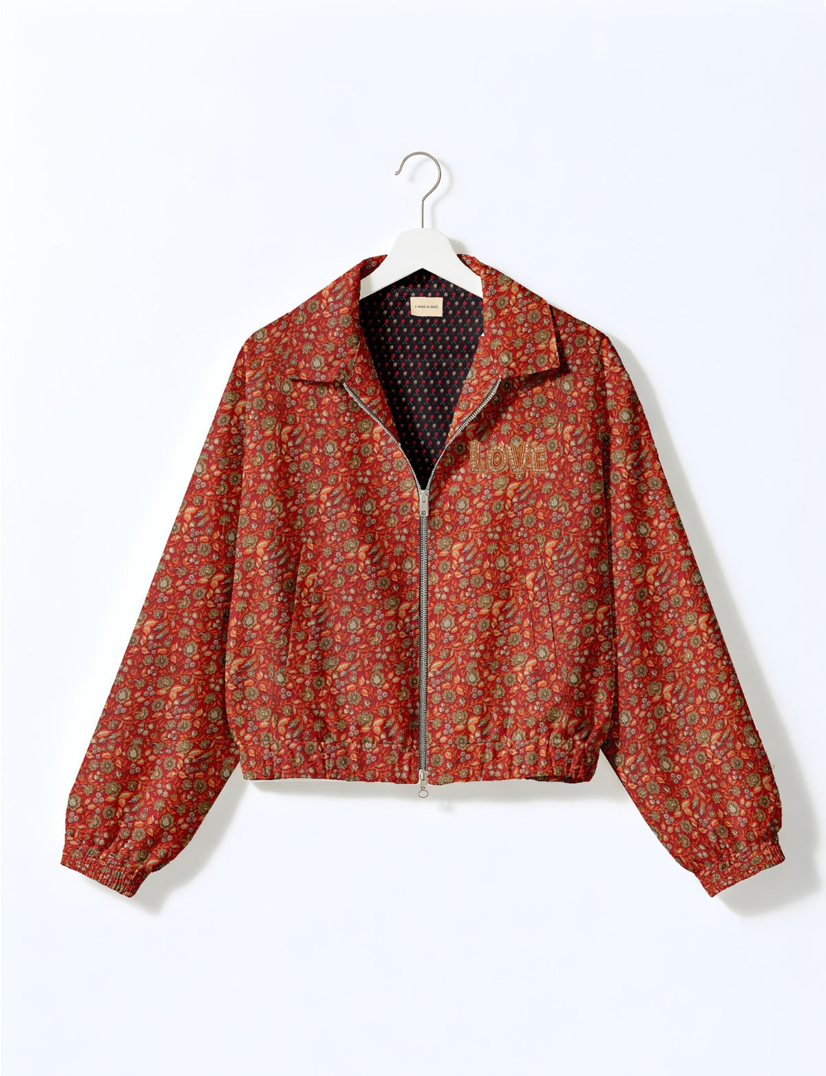 Love Bomber Jacket made from recycled fabric, featuring hand-stitched Aari embroidery. A unique piece of zero-waste clothing, part of the circular fashion movement. Designed with upcycled materials for a stylish yet environmentally friendly clothing choice.
