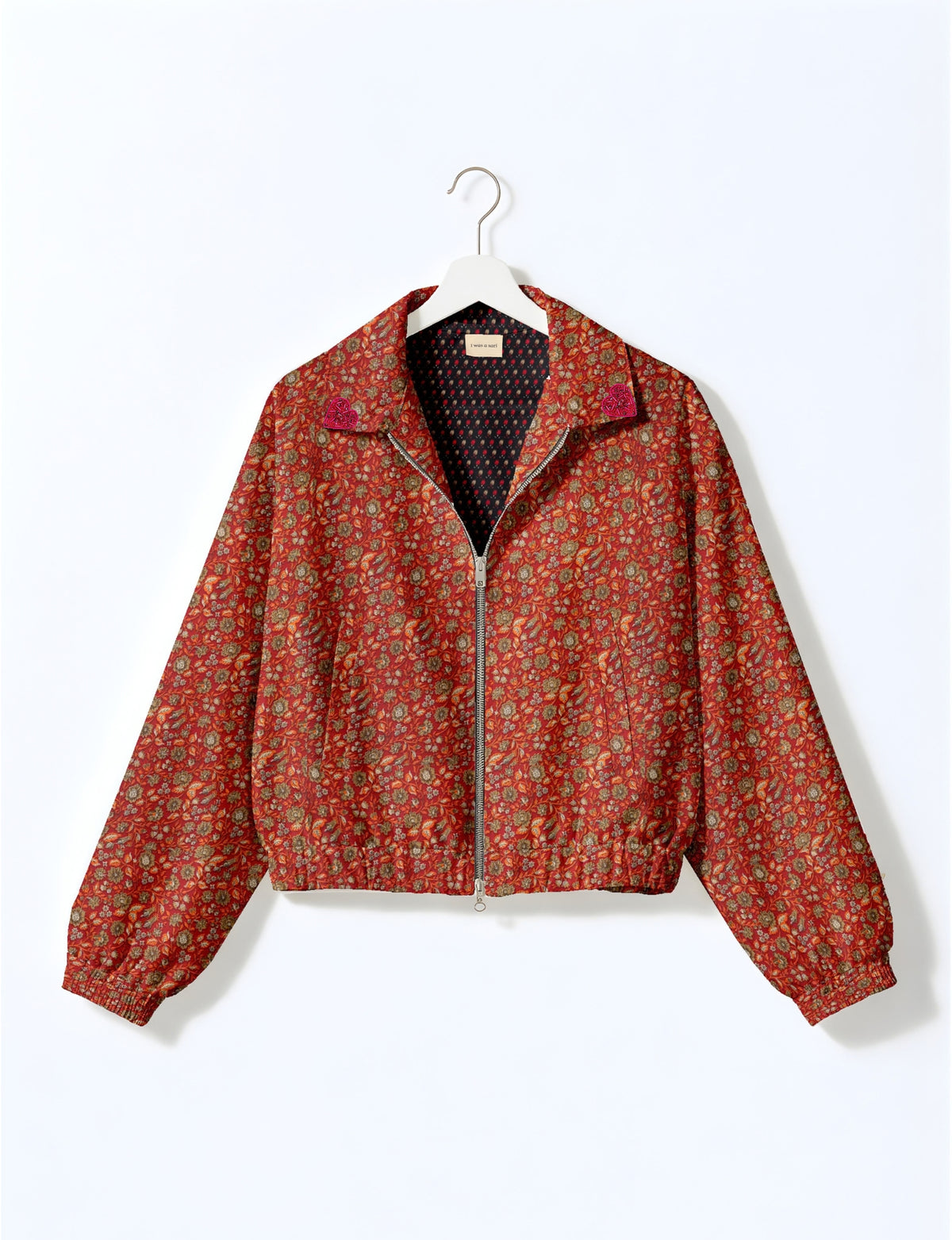 Love Bomber Jacket made from recycled fabric, featuring hand-stitched Aari embroidery. A unique piece of zero-waste clothing, part of the circular fashion movement. Designed with upcycled materials for a stylish yet environmentally friendly clothing choice.