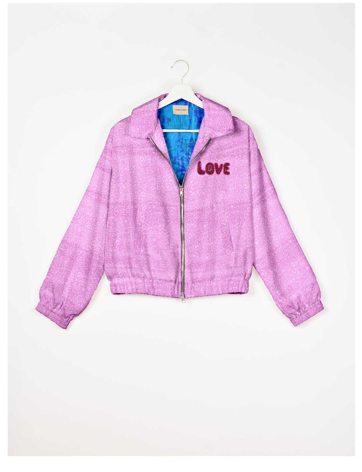 Love Bomber Jacket made from recycled fabric, featuring hand-stitched Aari embroidery. A unique piece of zero-waste clothing, part of the circular fashion movement. Designed with upcycled materials for a stylish yet environmentally friendly clothing choice.