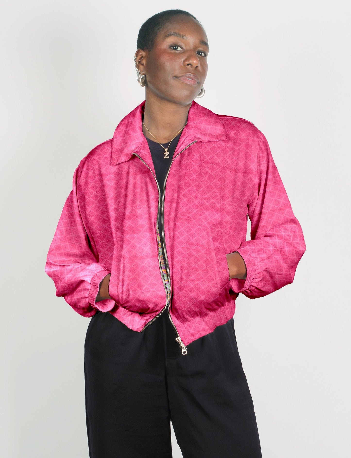 Stylish BOMBER JACKET, an upcycled clothing masterpiece with a cute cropped shape, elasticated details, and detachable metallic zipper. Contrast sari print lining adds a unique touch. Explore sustainable and eco-friendly fashion.