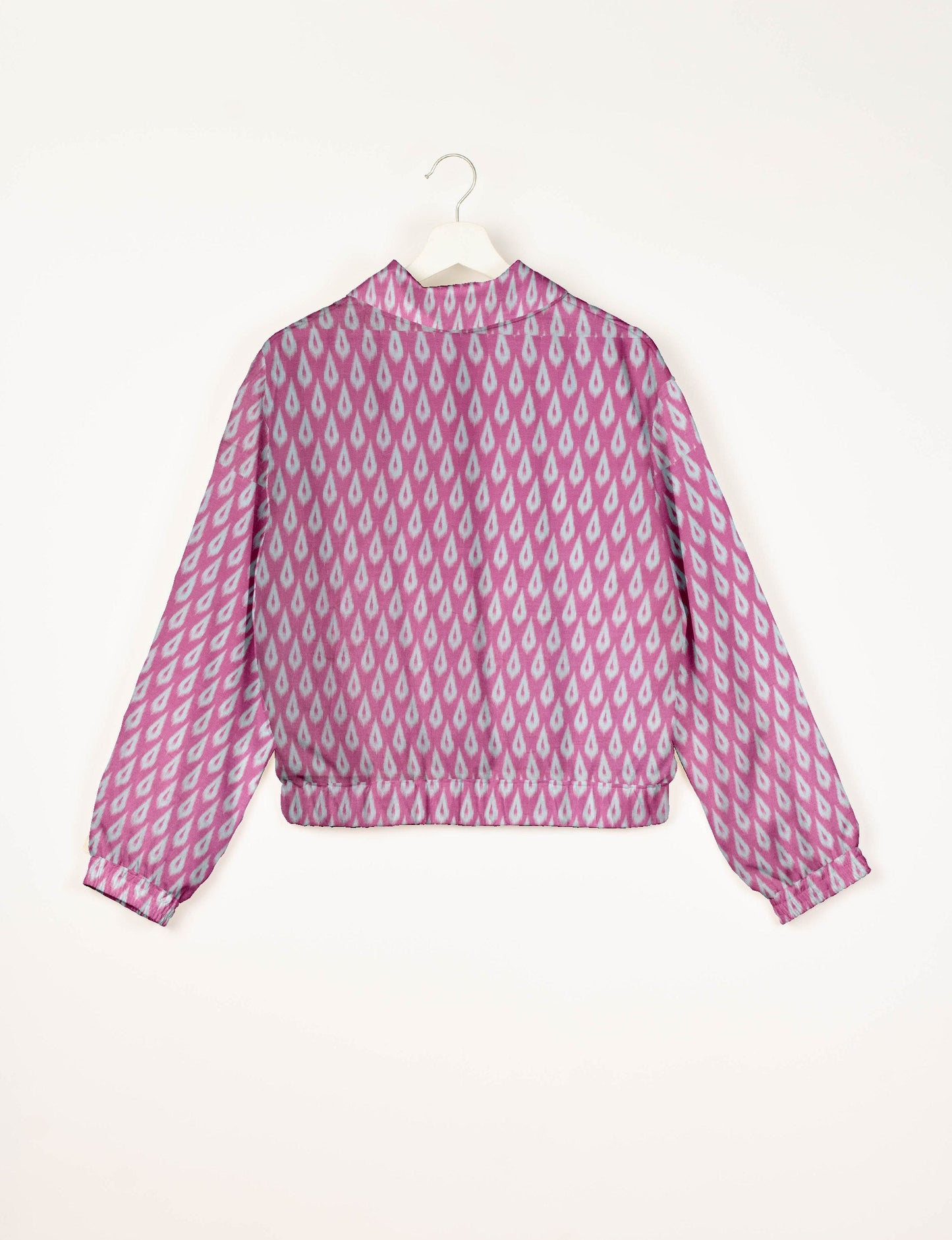 Upcycled Bomber Jacket made from recycled sari materials, featuring a cute cropped shape, elasticated hem and cuffs, and contrast sari print lining. Sustainable apparel promoting eco-friendly fashion and ethical clothing.