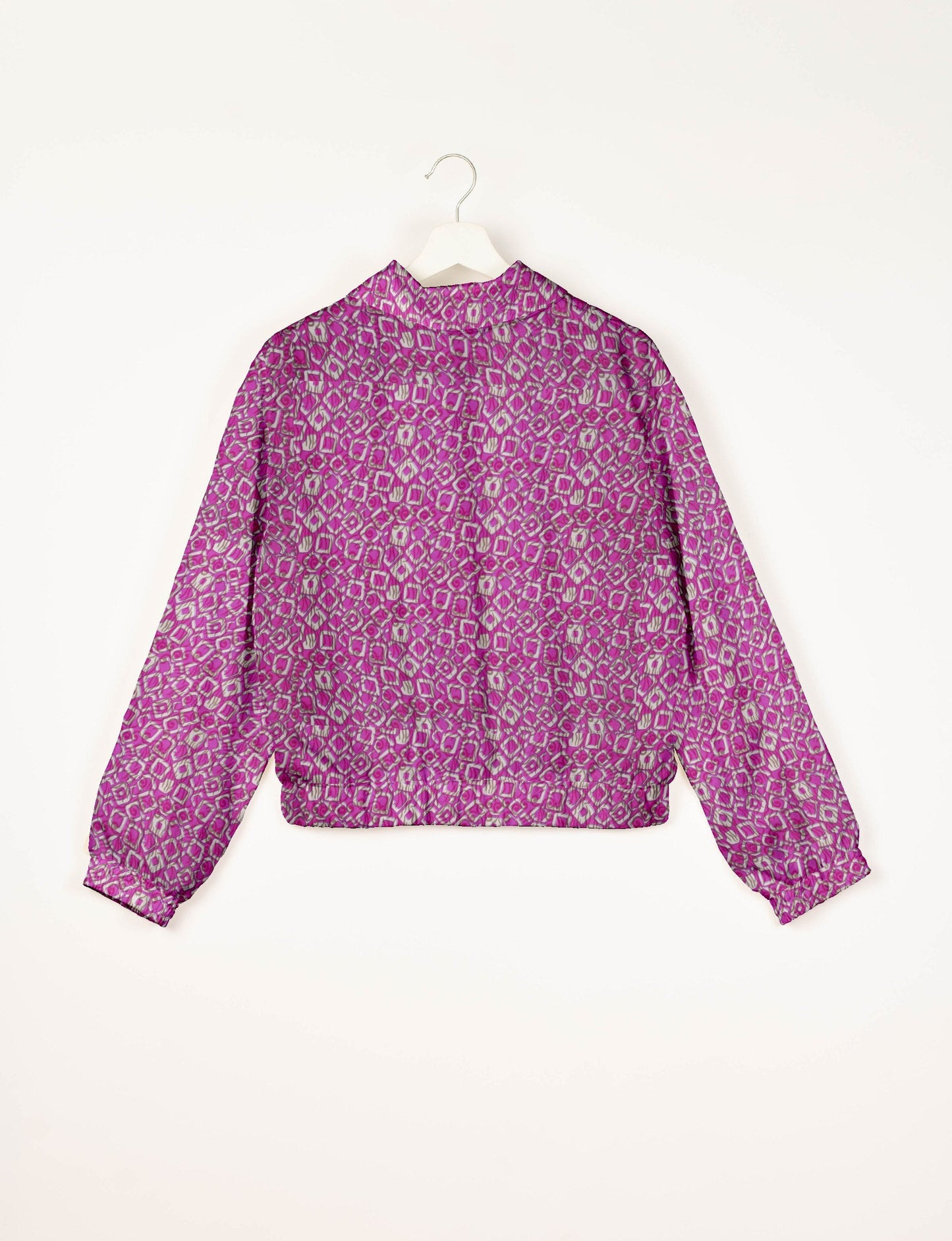 Upcycled Bomber Jacket made from recycled sari materials, featuring a cute cropped shape, elasticated hem and cuffs, and contrast sari print lining. Sustainable apparel promoting eco-friendly fashion and ethical clothing.