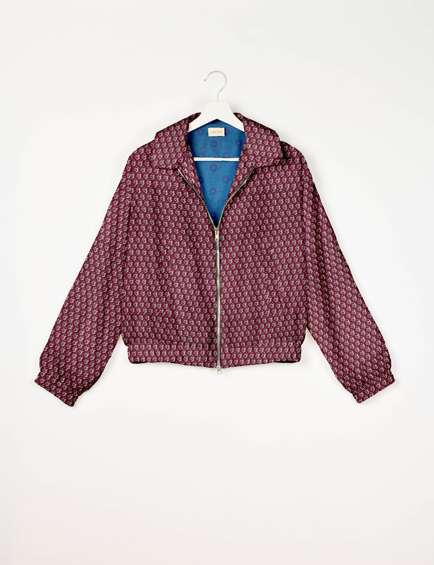 Upcycled Bomber Jacket made from recycled sari materials, featuring a cute cropped shape, elasticated hem and cuffs, and contrast sari print lining. Sustainable apparel promoting eco-friendly fashion and ethical clothing.