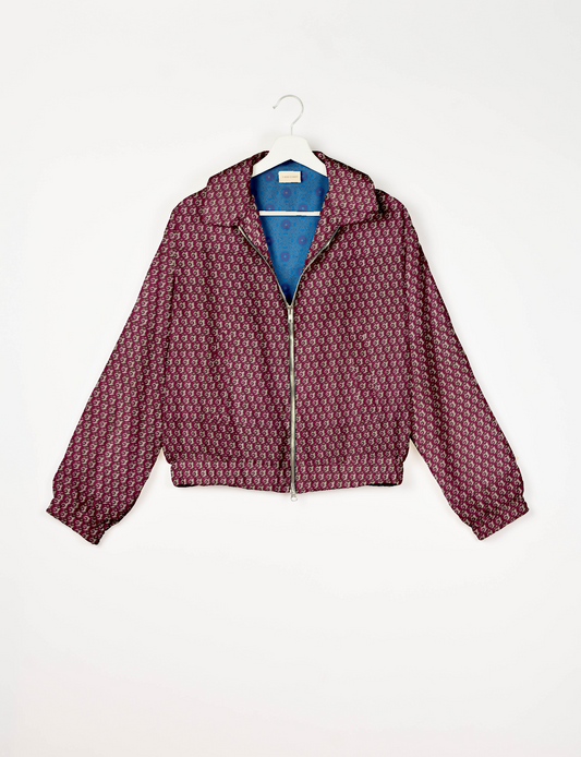 Upcycled Bomber Jacket made from recycled sari materials, featuring a cute cropped shape, elasticated hem and cuffs, and contrast sari print lining. Sustainable apparel promoting eco-friendly fashion and ethical clothing.