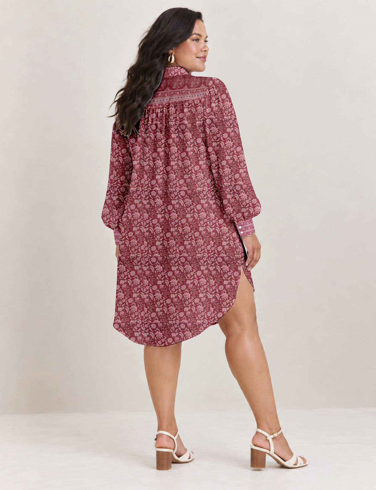 High low shirt with a relaxed fit, button-down front, classic collar, gathered shoulders and full-length blouson sleeves.