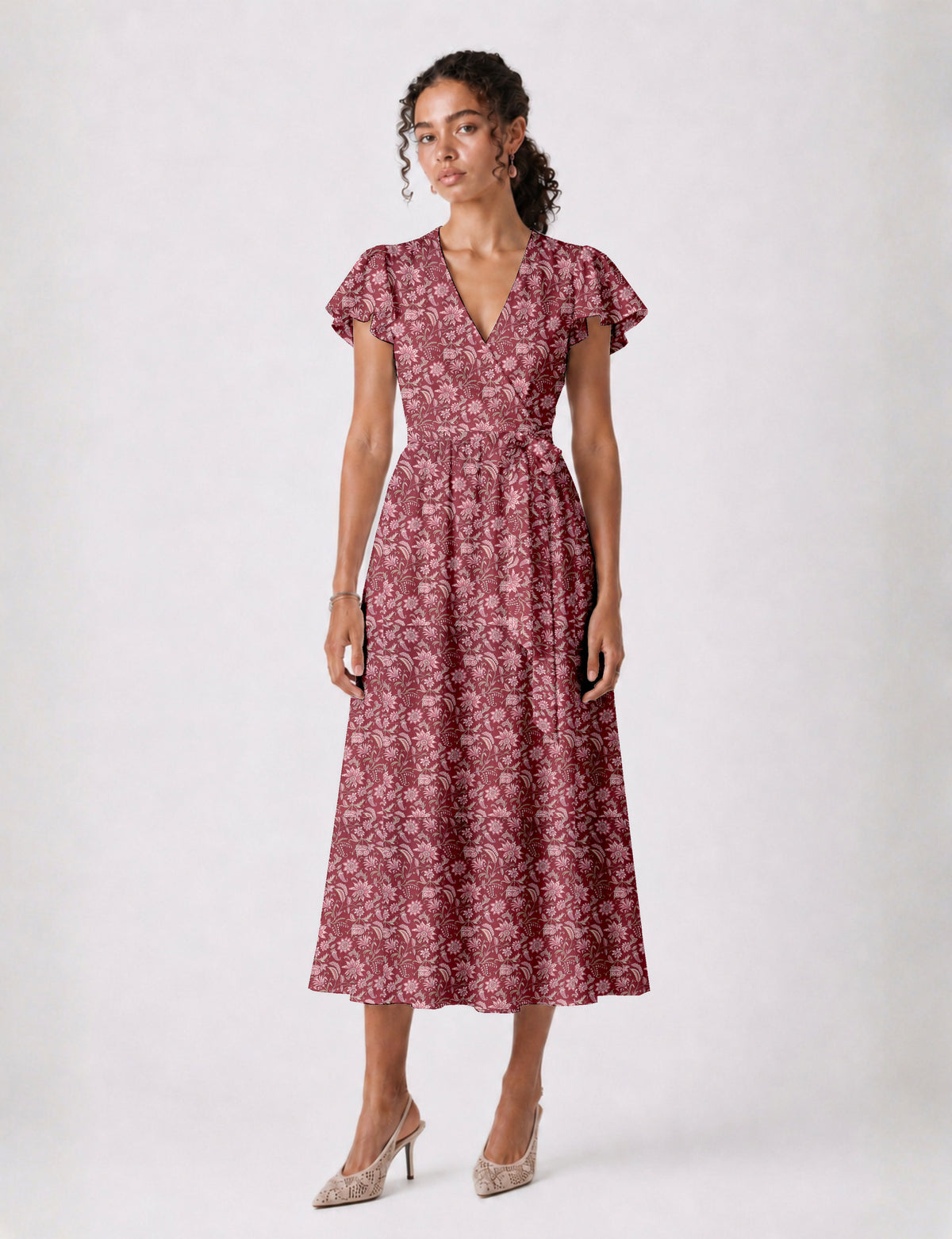 Elegant midi wrap dress with a V-neckline, adjustable waist tie, fitted bodice, and flared skirt for a timeless, flattering silhouette.