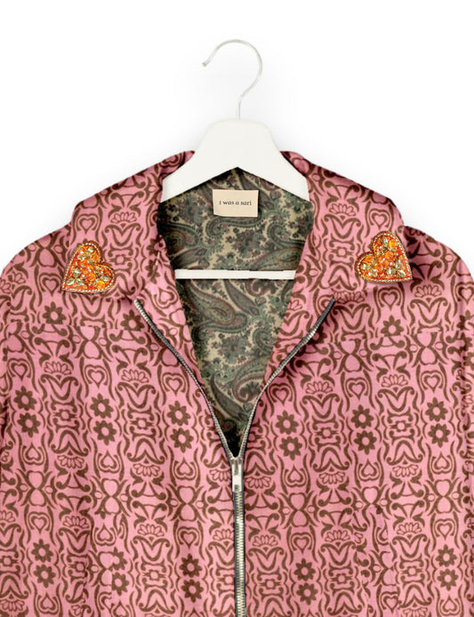 Make a bold statement with our Heart Drop Earrings, a symbol of conscious luxury and ethical fashion. Handcrafted using the intricate Aari embroidery technique, these earrings are made from upcycled sari fabric, embracing slow fashion and zero waste clothing. Elevate your look with sustainable apparel that supports fair trade fashion while reducing textile waste. Choose eco-friendly fashion that speaks of love, artistry, and responsibility.