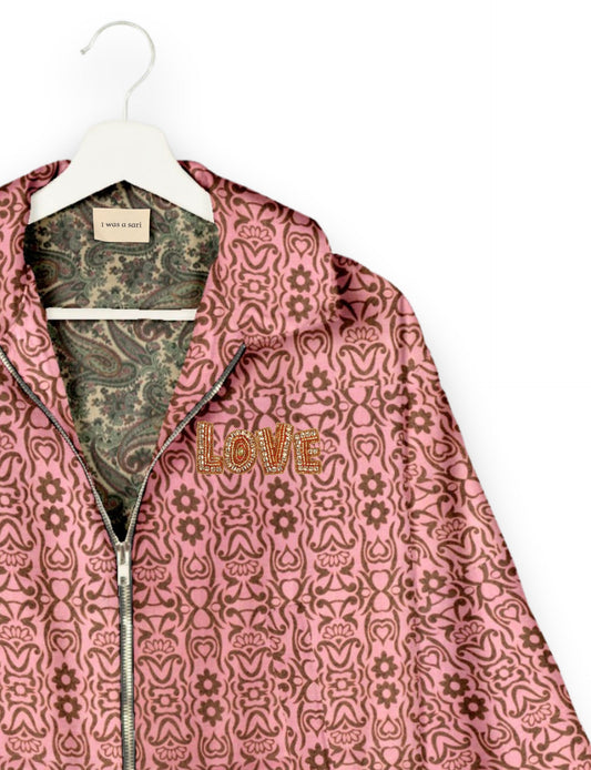 Love Bomber Jacket made from recycled fabric, featuring hand-stitched Aari embroidery. A unique piece of zero-waste clothing, part of the circular fashion movement. Designed with upcycled materials for a stylish yet environmentally friendly clothing choice.