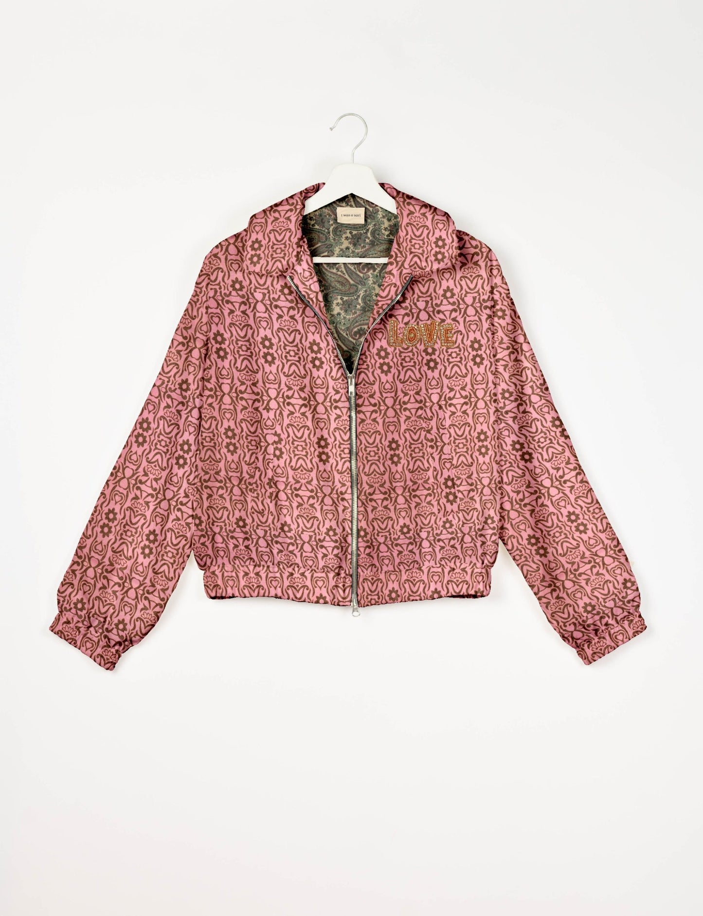Love Bomber Jacket made from recycled fabric, featuring hand-stitched Aari embroidery. A unique piece of zero-waste clothing, part of the circular fashion movement. Designed with upcycled materials for a stylish yet environmentally friendly clothing choice.