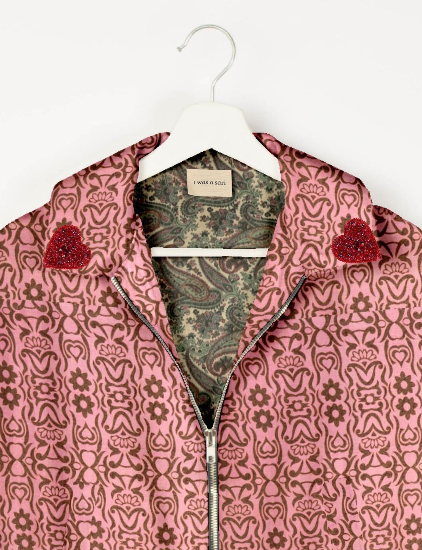 Make a bold statement with our Heart Drop Earrings, a symbol of conscious luxury and ethical fashion. Handcrafted using the intricate Aari embroidery technique, these earrings are made from upcycled sari fabric, embracing slow fashion and zero waste clothing. Elevate your look with sustainable apparel that supports fair trade fashion while reducing textile waste. Choose eco-friendly fashion that speaks of love, artistry, and responsibility.