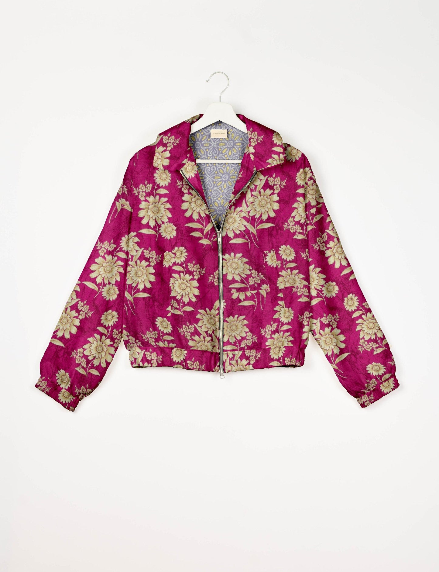 Upcycled Bomber Jacket made from recycled sari materials, featuring a cute cropped shape, elasticated hem and cuffs, and contrast sari print lining. Sustainable apparel promoting eco-friendly fashion and ethical clothing.